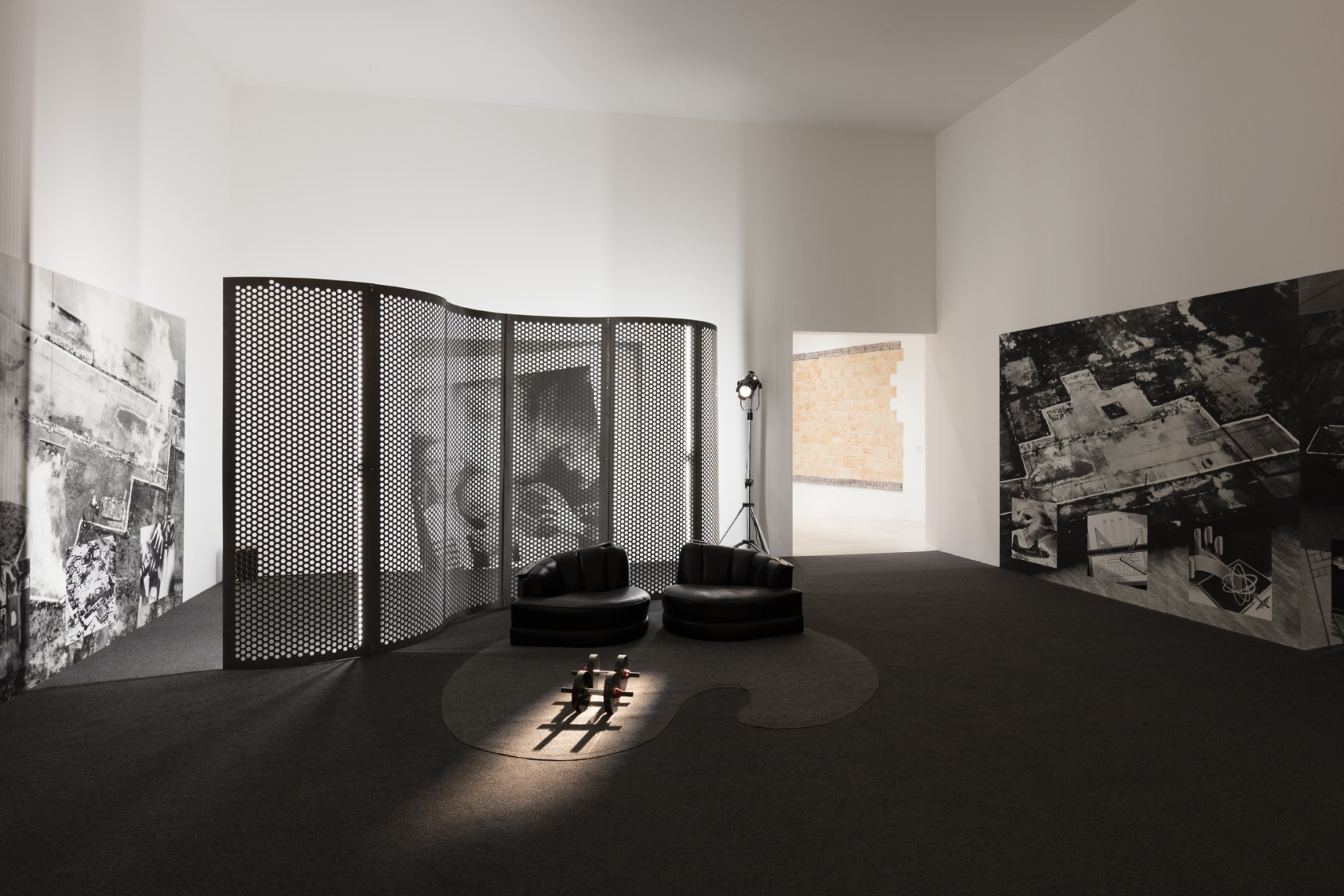 Reconstructing Futures, 1977 14 photomontage panels, 2 vinyl-upholstered seats, 2 marble and steel barbells, synthetic carpet, 2 copper- and metal-plated...