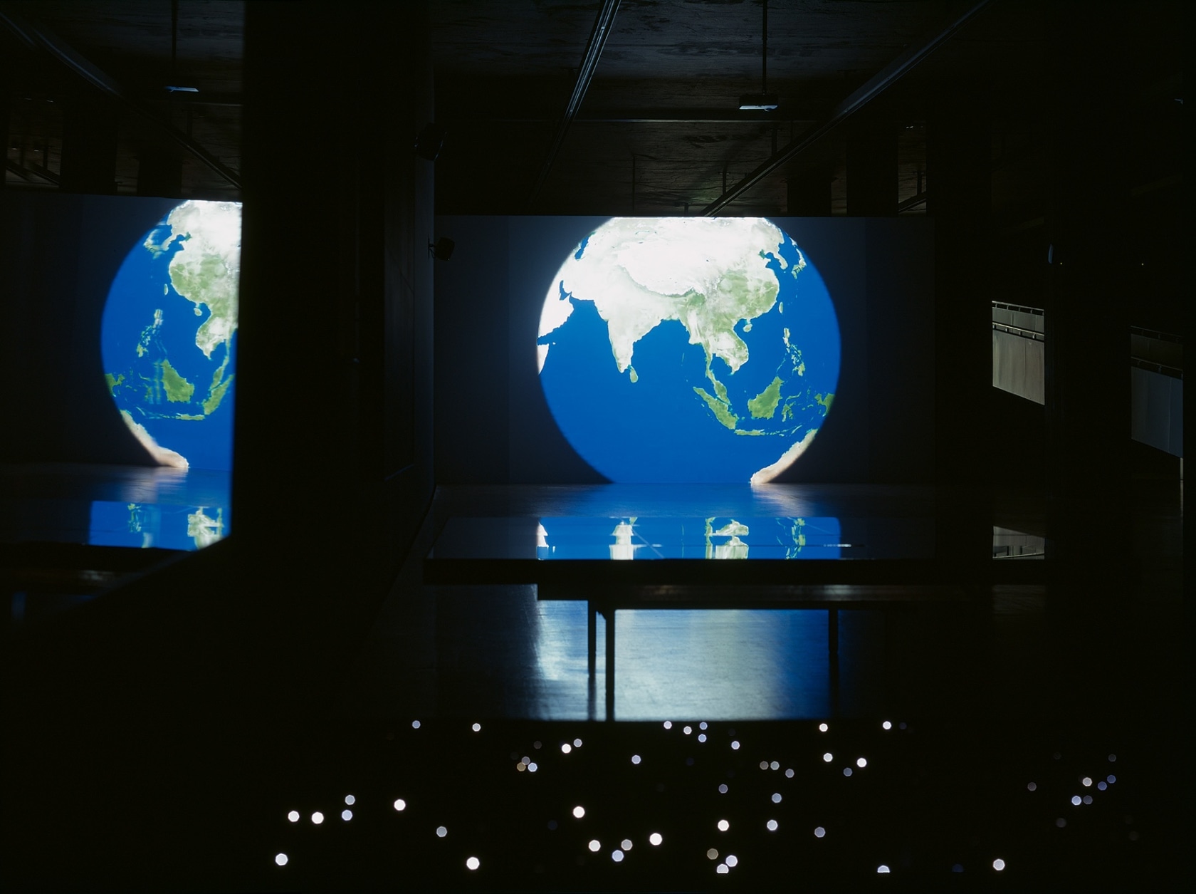 Last Year Again, 2008 Synchronized double projection, digital video animation 3´06´´ Projected on two sides of a freestanding rectangular wall...