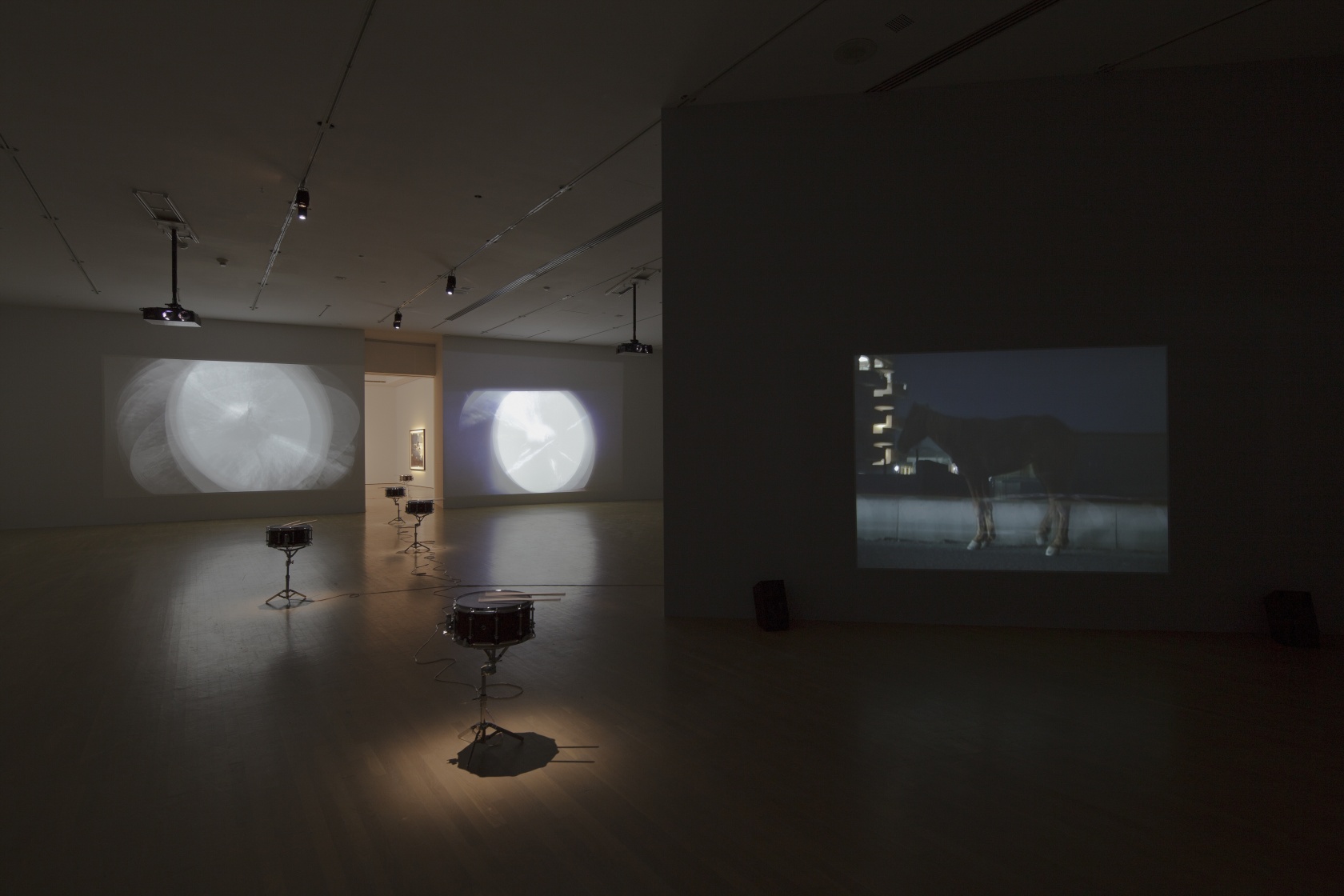 After Three Minutes, 2007 (both sides of the door) Two-channel video installation Doldrums, 2008 (on the floor) Altered Brady snare...