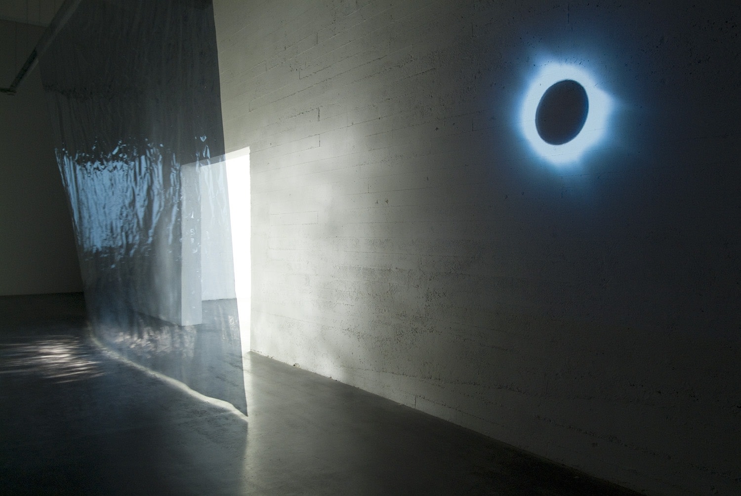 Untitled (Golden section), 2009 (left) (in collaboration with Michel François) Polyester reflecting film without mirror-coating, profile spot 1000 watt Side...