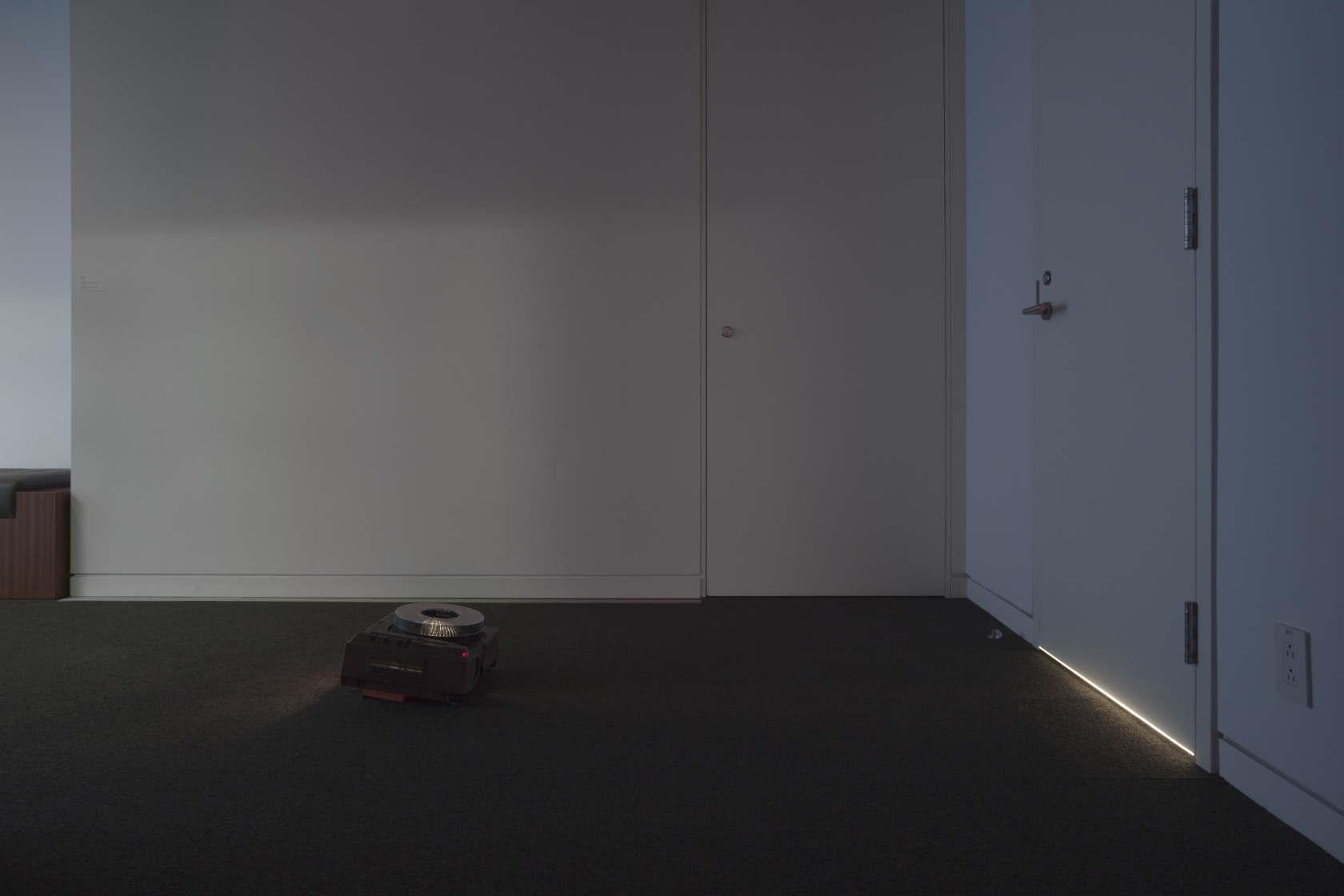 Door, 1995 Light projection/installation, 35mm metal mask slide, slide projector A fine horizontal strip of light is projected onto the...