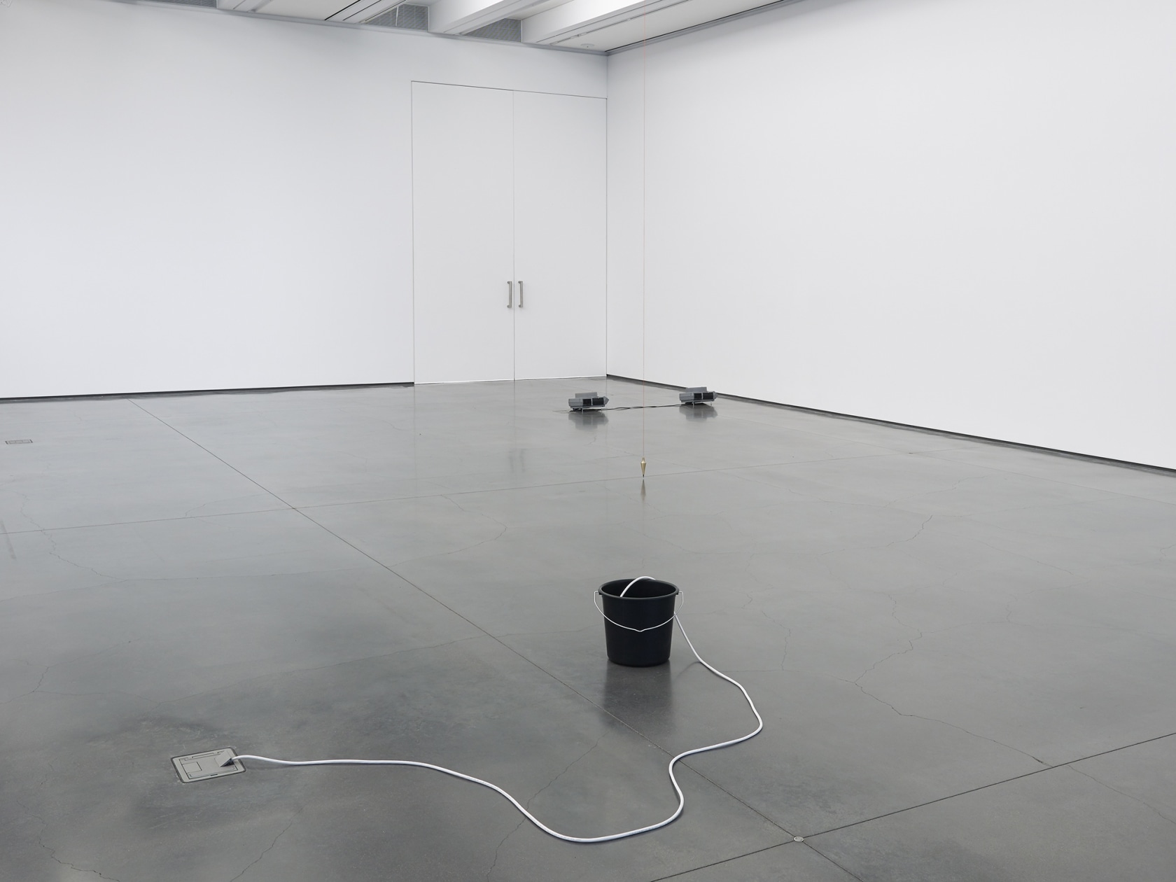 From front to back: Bucket, 1999 CD, portable CD player with a single, active audio speaker, black plastic bucket, electrical...