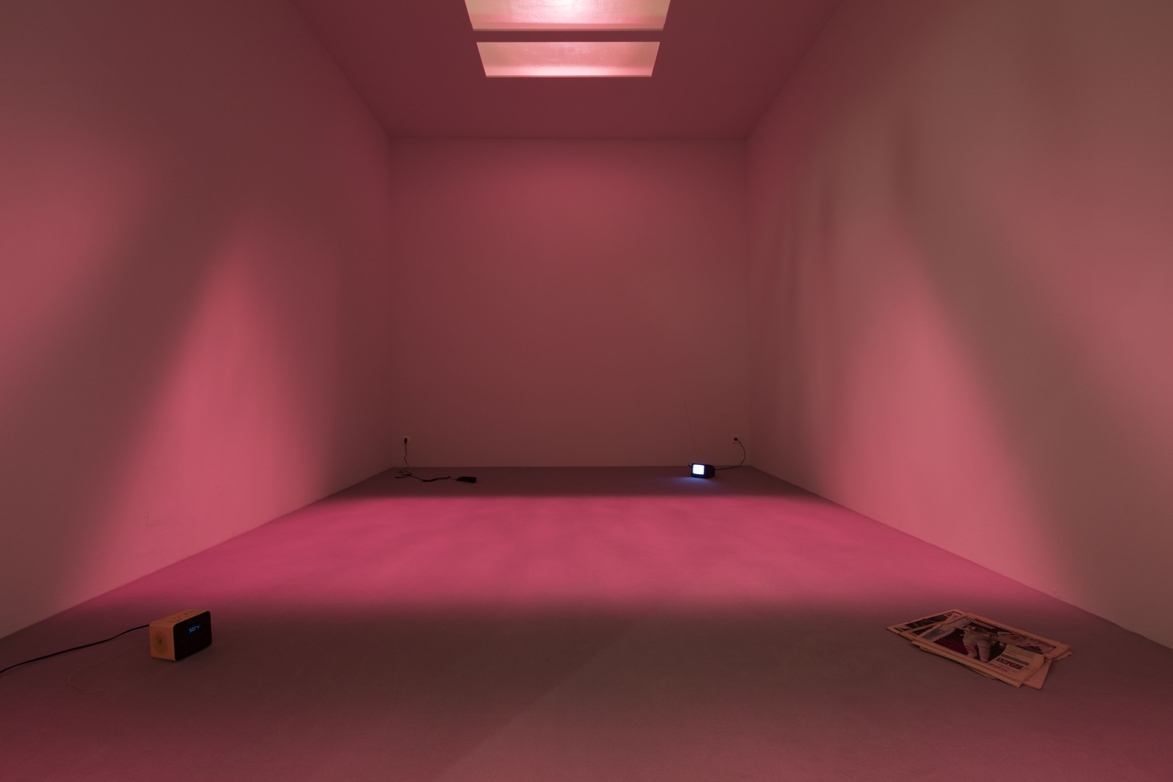 Une Chambre En Ville, 1996 Newspapers, telephone, mini television, radio alarm clock, lighting system emitting light that changes from blue...