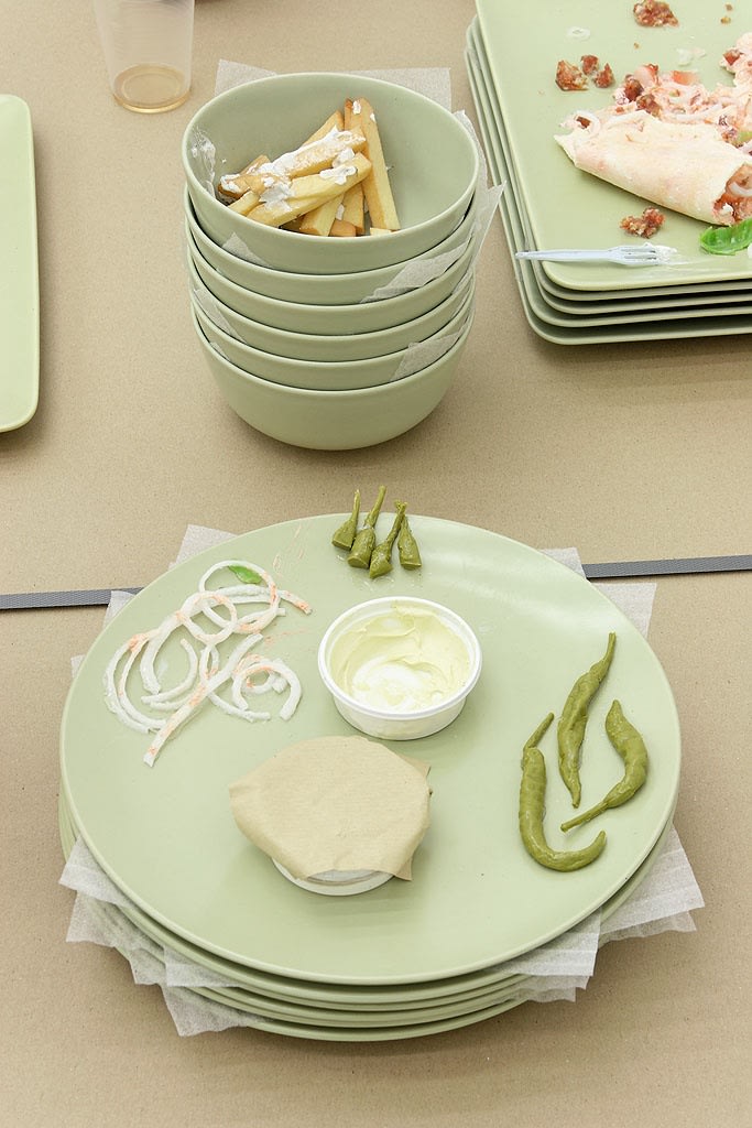 A calculated journey into a calculated experience, 2007 (detail) Fake food, dishes, 2 chairs, Ikea carton The rectangular flat carton...