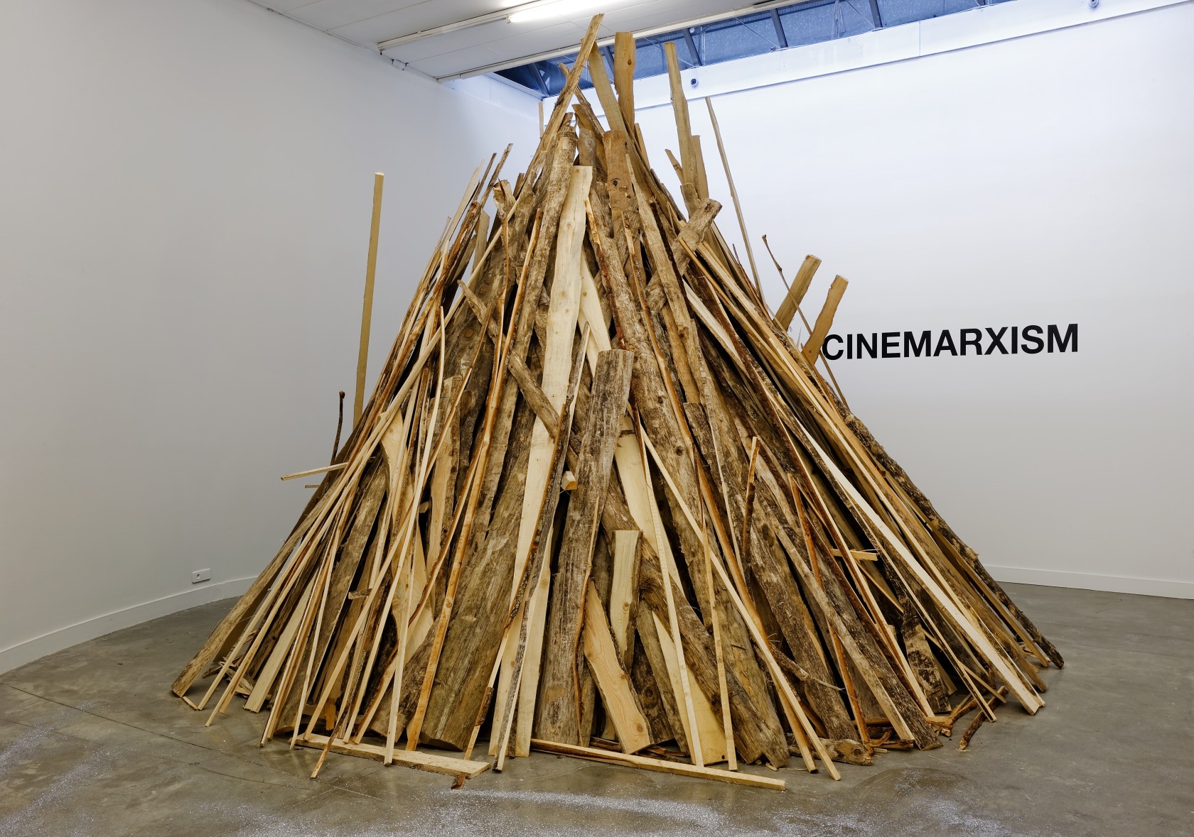 When Do We Need More Tractors? Five Plans, 1999 Wood, vinyl wall text, vodka, glitter, lemon Photo © Blaise Adilon