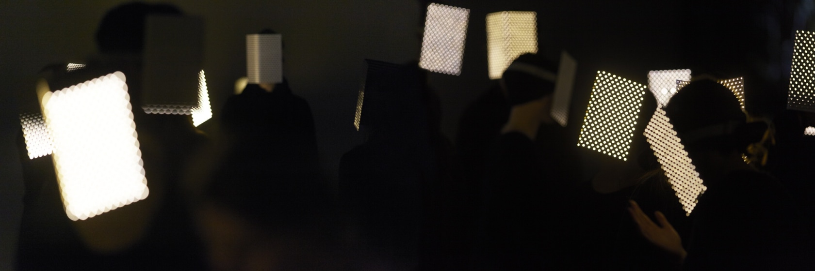 Swarm, 2016 View of performers wearing lit LED masks during the opening of the exhibition Photo © Ola Rindal