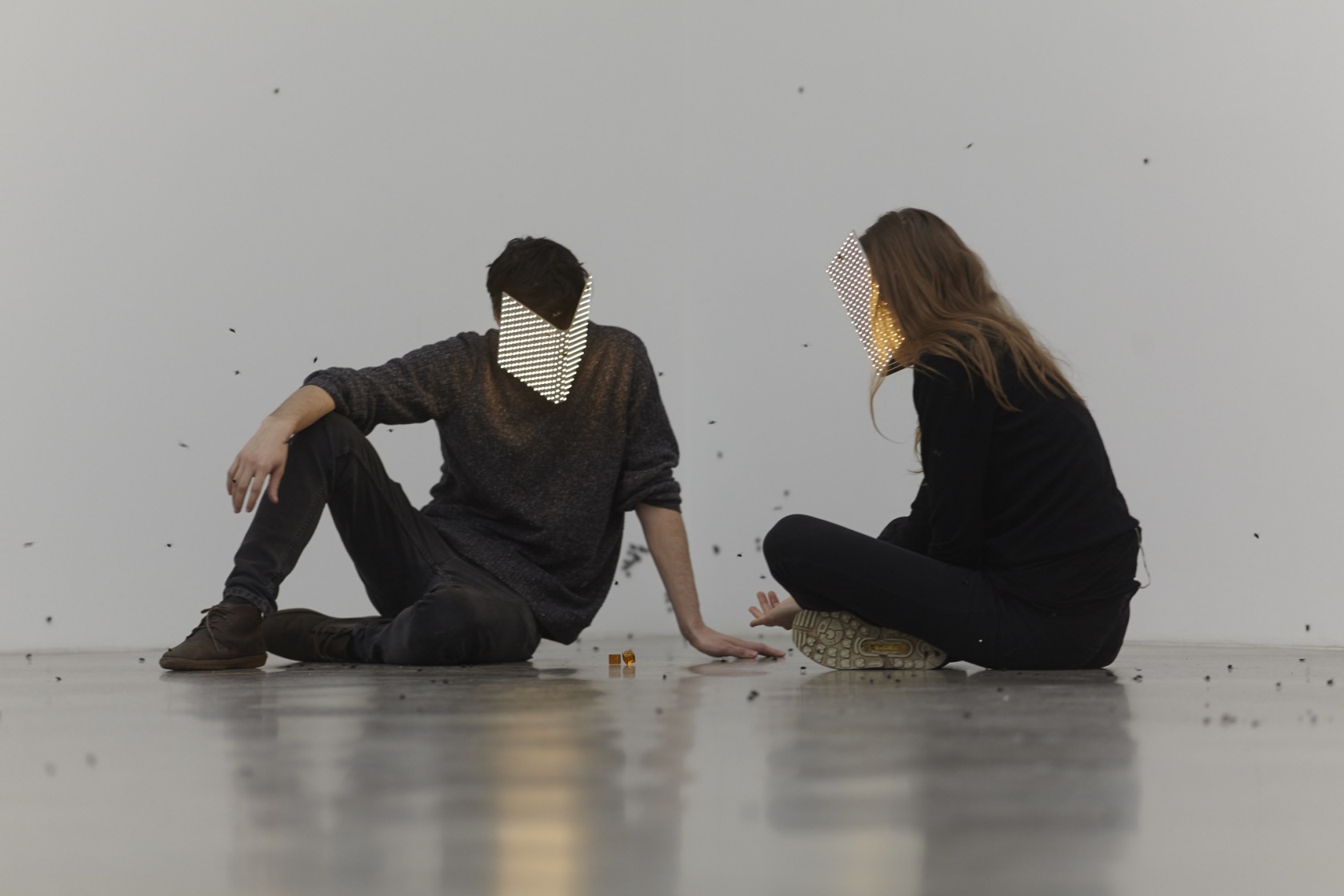 Mating, 2015 Programmed masks, LED, brass, strap, dice, amber, insects A man and a woman play a game of dice,...