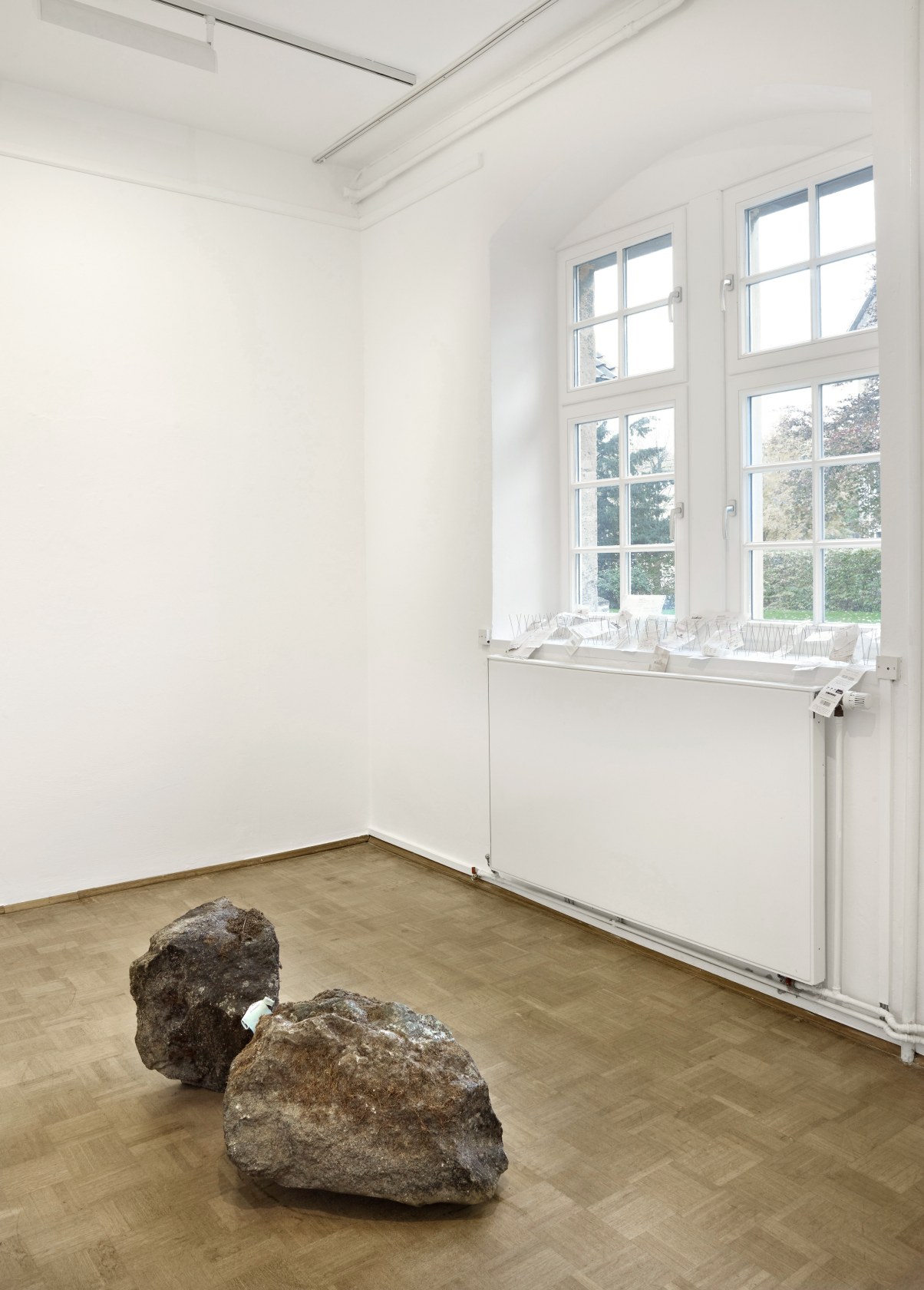 Fountain, 2010 (foreground) Rocks, paper By means of minimal gestures, Kuri draws attention to the weight of banal everyday items...