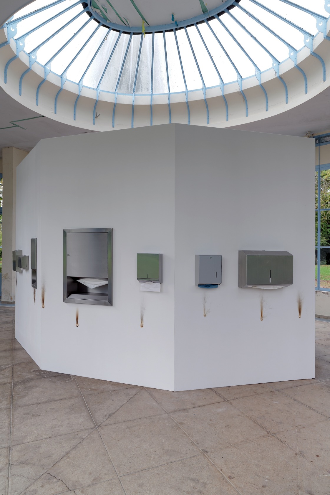 Bottled Water P.d.S. 1, 2013 Stainless steel paper dispensers (7 units), paper, burns on wall (8) Usually part of the...