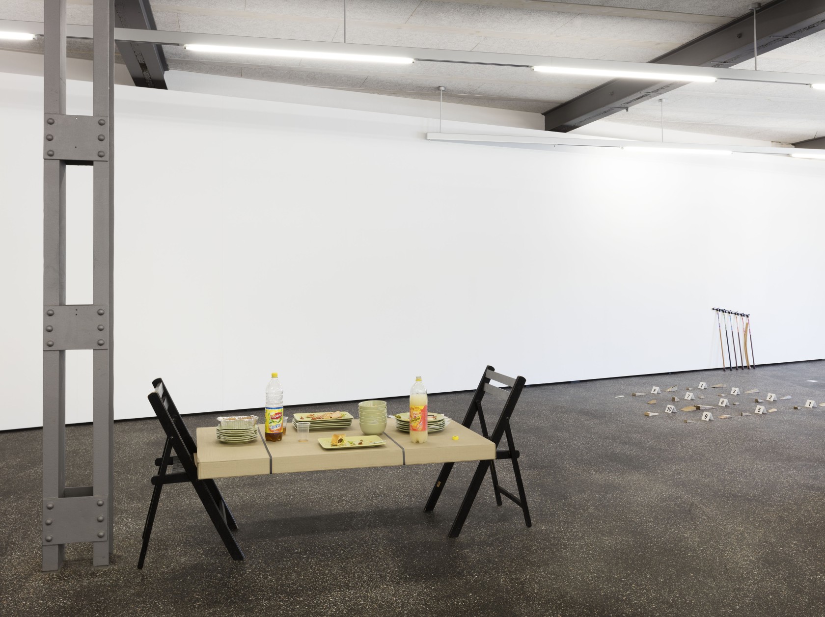 A calculated journey into a calculated experience, 2007 (foreground) Latex, synthetic resin, plates, two chairs, IKEA box The rectangular flat...