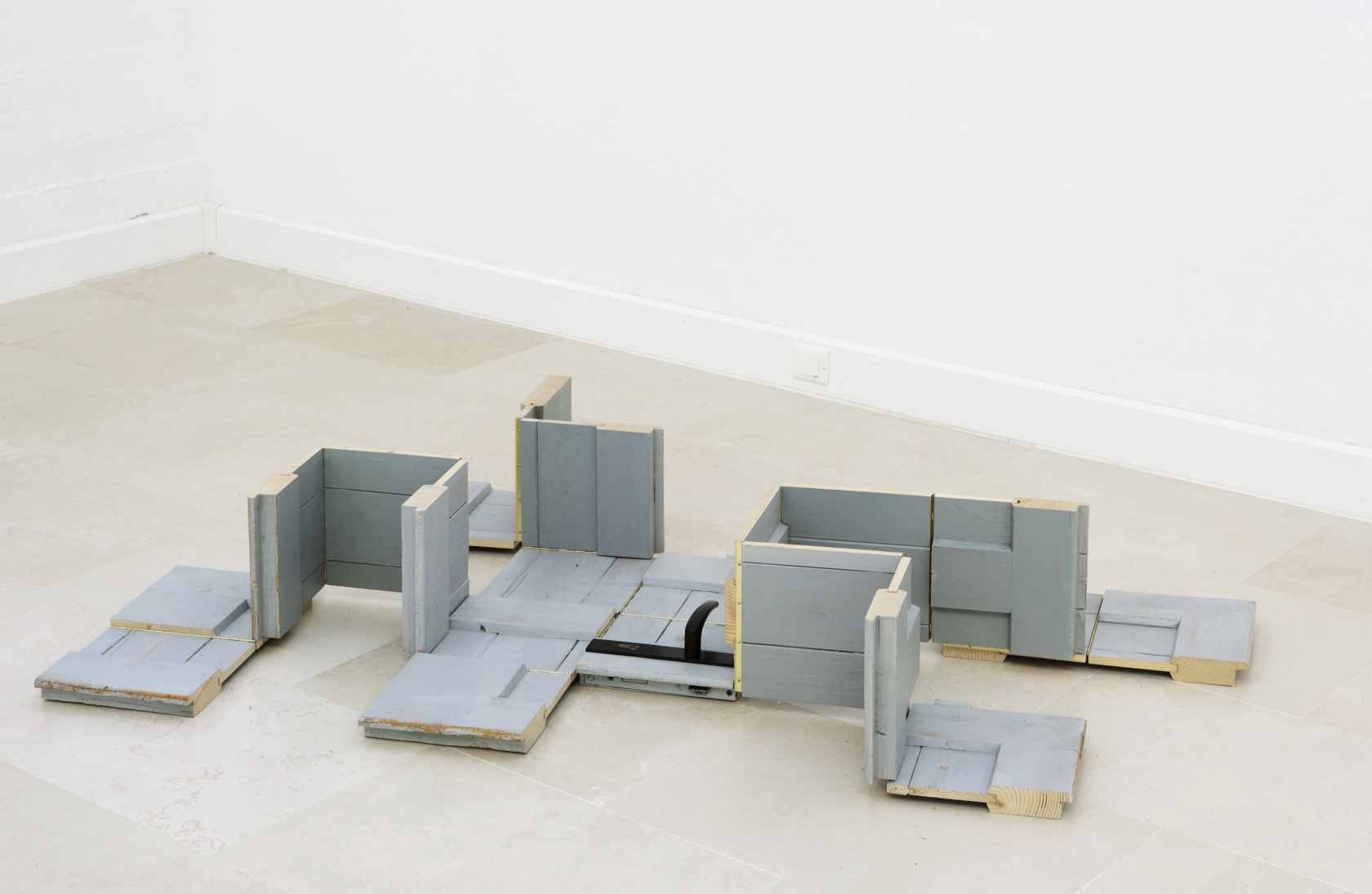 Door Leading to Many Directions, 1997 Cut and reconfigured wooden door, piano hinges Photo © Jean Bastille