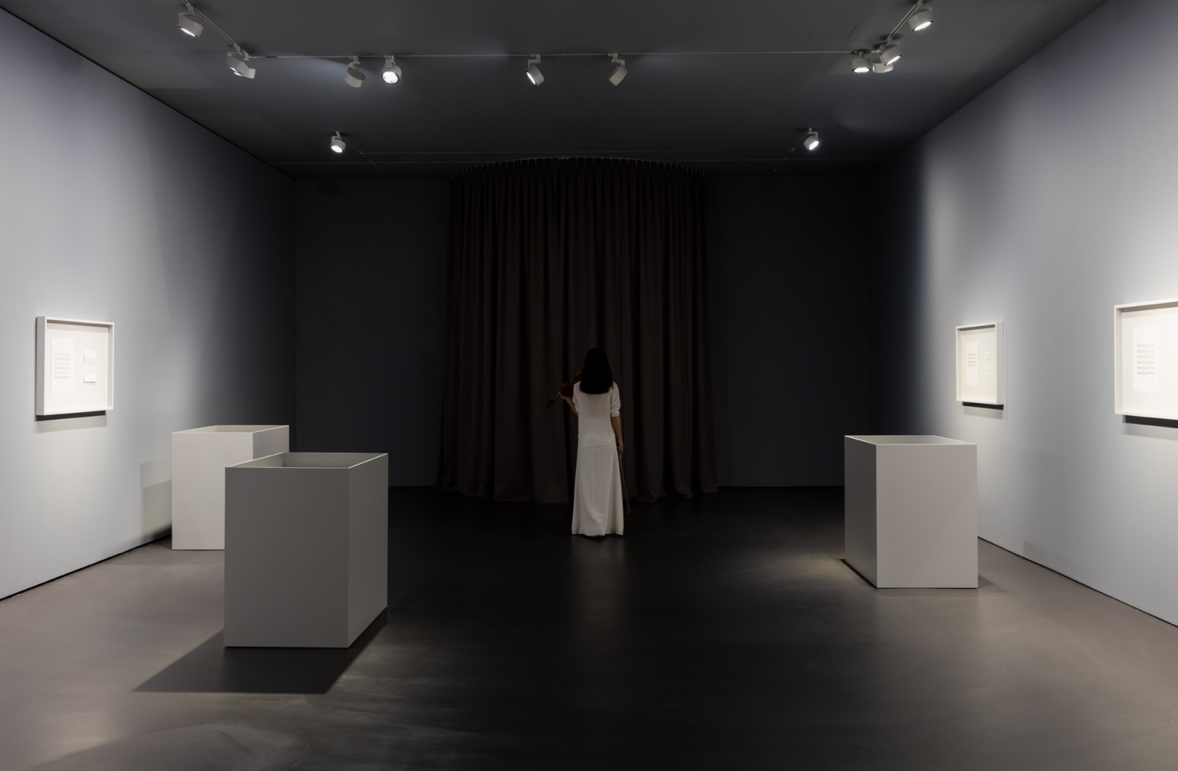 Solo for Ayumi, 2017 Ayumi Paul performing Ari Benjamin Meyers’ score in the exhibition space, surrounded by twelve diptychs consisting...