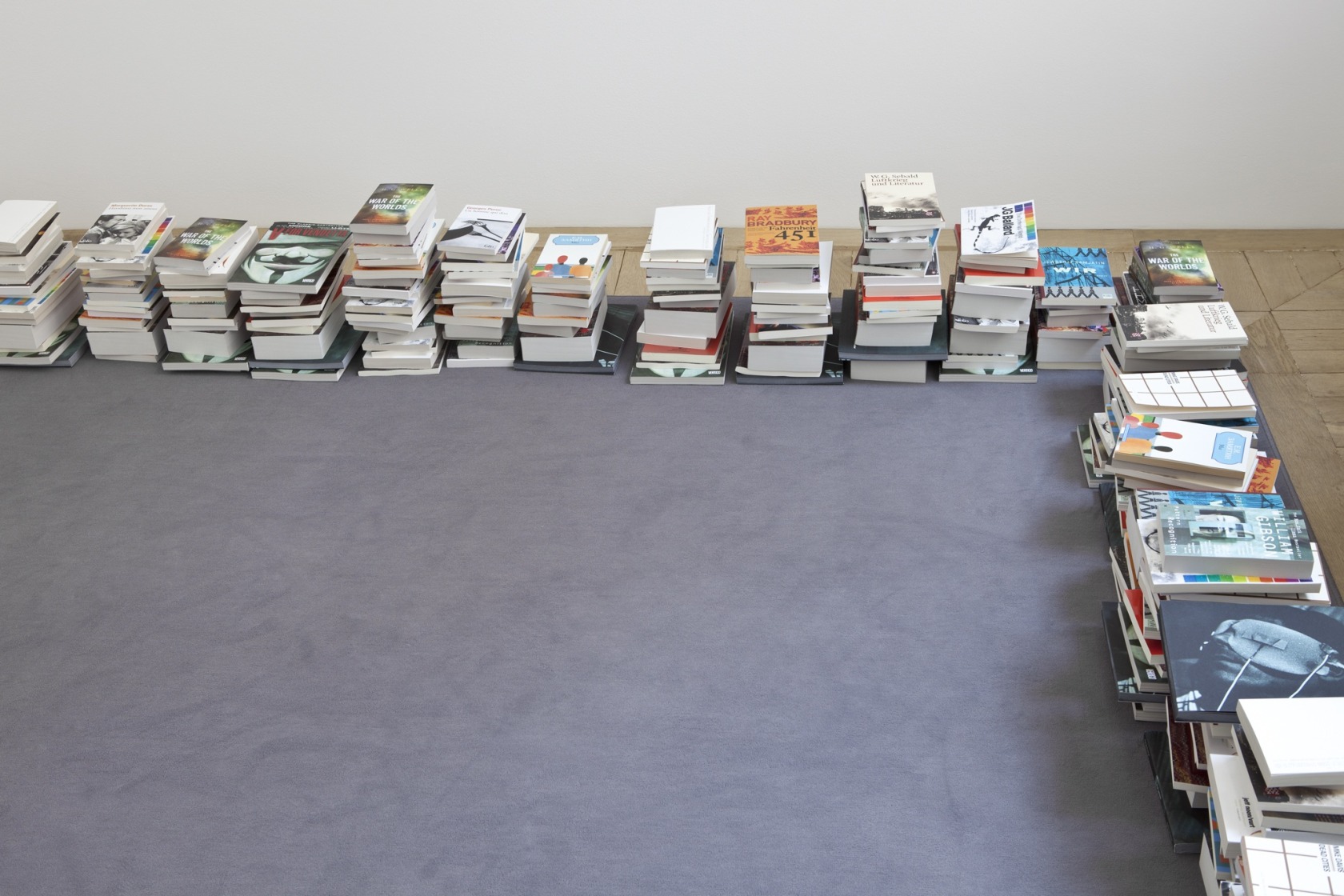 2058 (Bibliography), 2012 Grey carpet, 400 books With this exhibition the artist returns to both the film Noreturn and her...