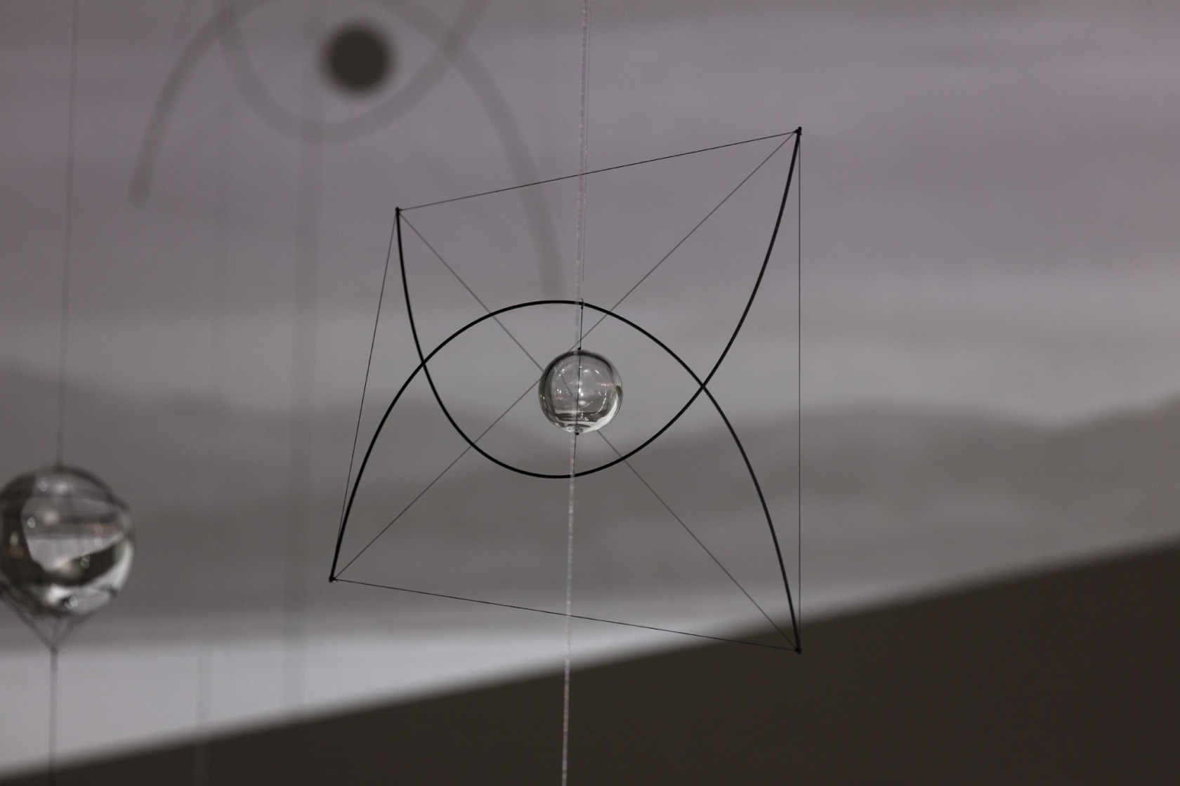 RAY 193, 2017 Hand-blown glass sphere, carbon fibre, rope, metal, fishing line 45 x 60 x 60 cm Exhibition view:...