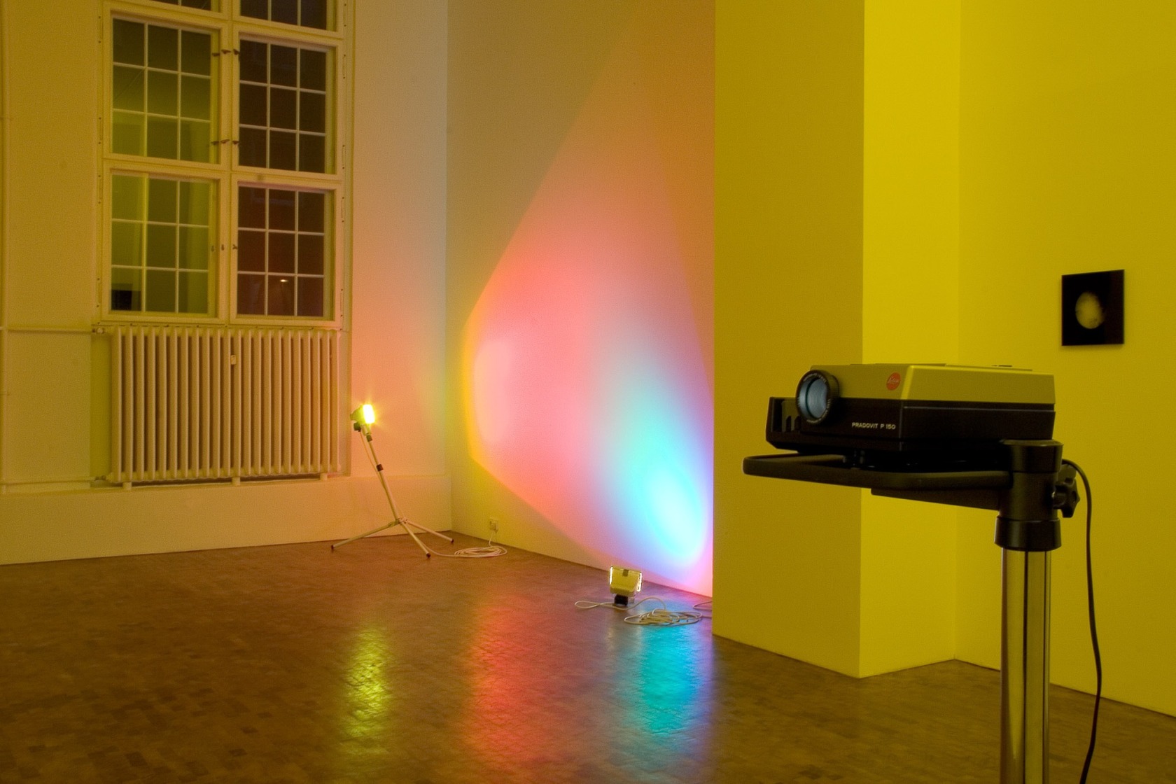 Ann Veronica Janssens Red & Turquoise, 2005 (left) 2 Halogen lamps, dichroic color filters, tripod 300 x 475 cm approx...