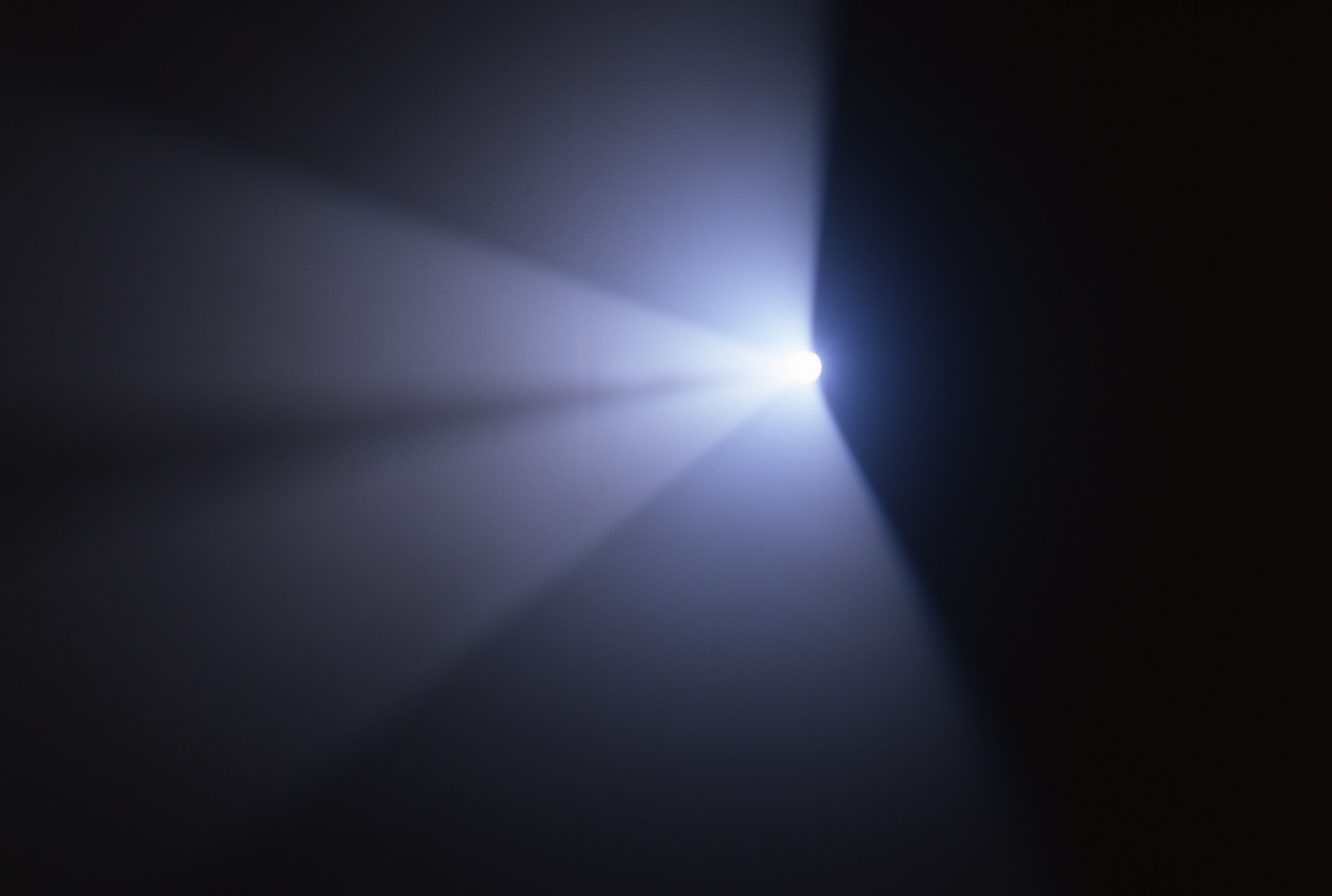 X, 2005 600 W lamp (Strand SL 15/32), tripod, gobo, colour filter, artificial fog Dimensions variable Photo © Carsten Eisfeld