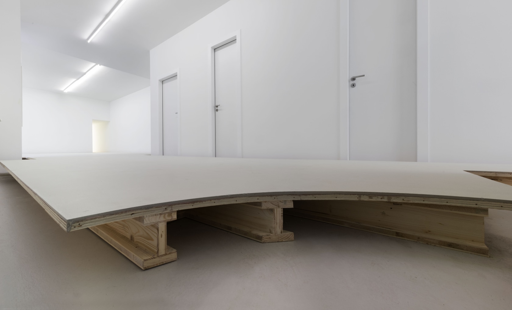 Floor, 1991/2016 Wood, concrete A second floor, built 15 cm above the actual floor of the gallery, raises visitors slightly...
