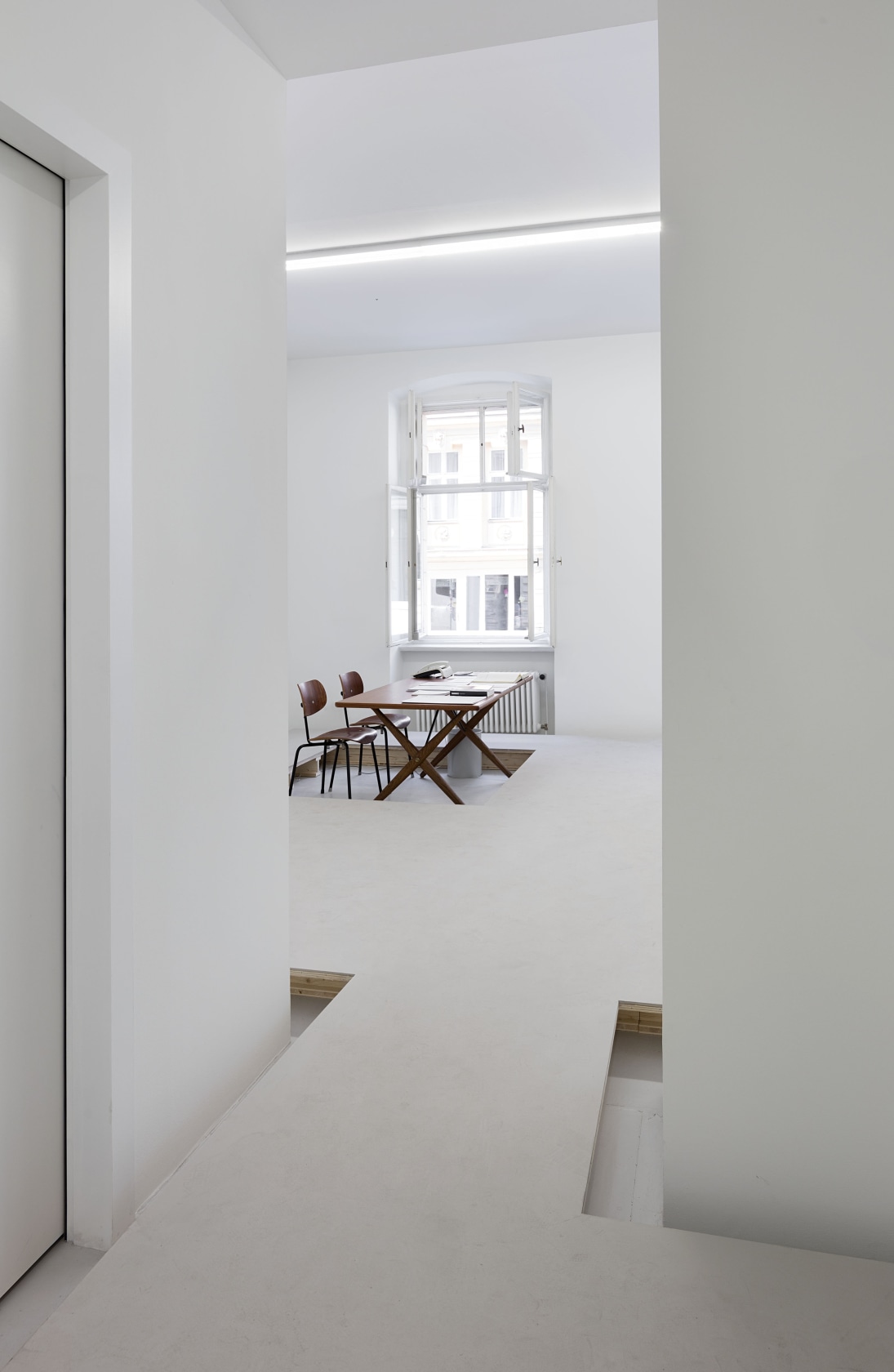 Floor, 1991/2016 Wood, concrete A second floor, built 15 cm above the actual floor of the gallery, raises visitors slightly...