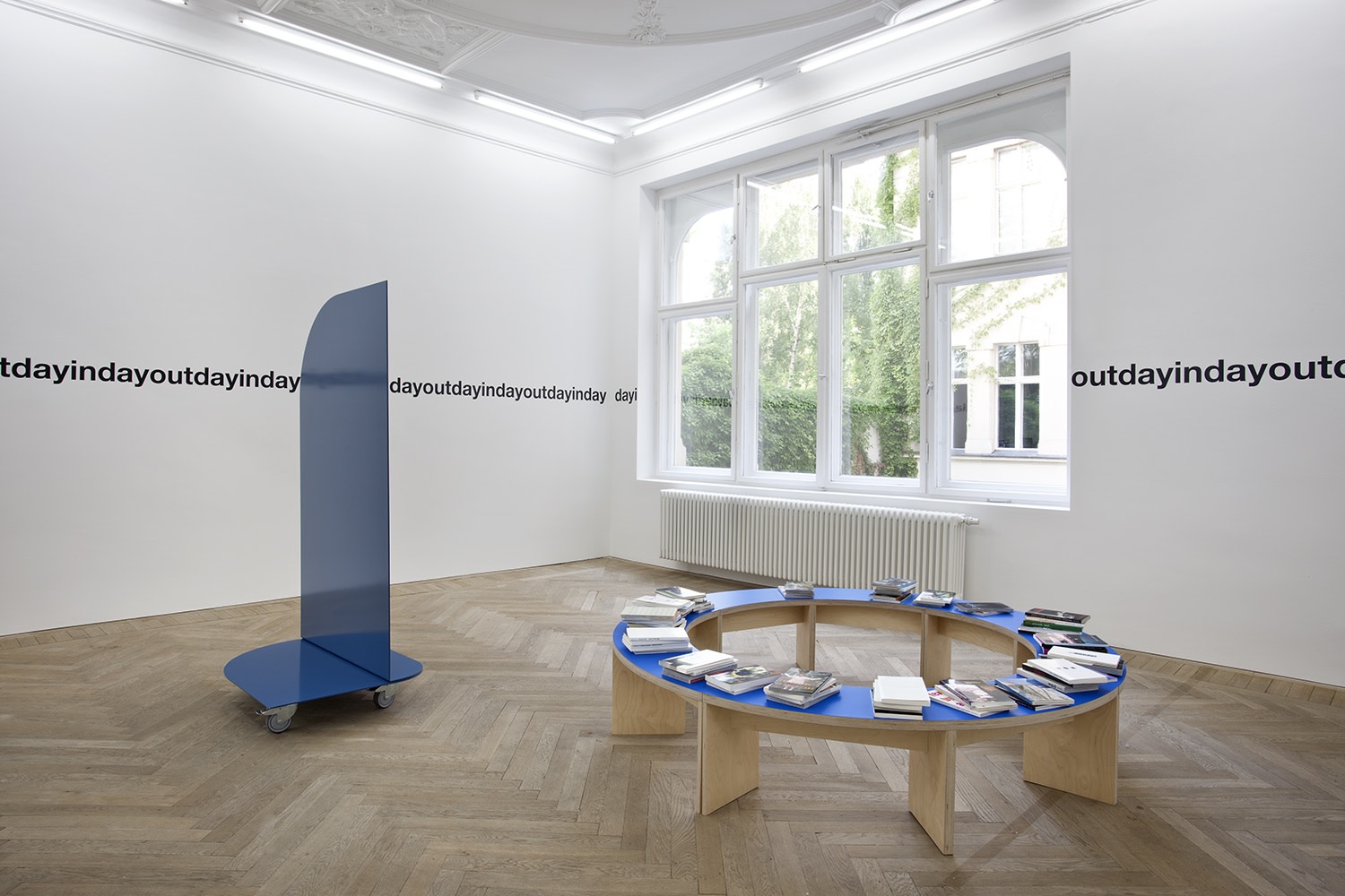Liam Gillick Bluer Monday, 2002 (left and right) Vinyl text on wall Dimensions variable Gabriel Kuri Element B.2, 2012 (left)...