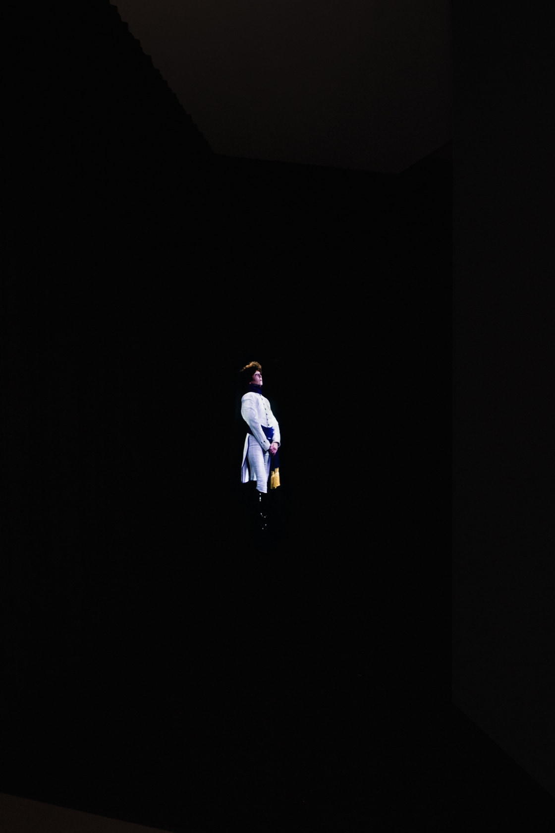 TEATRO (QM.15), 2016 HD video, projector, blue velvet curtain, media player, amplifier, speakers Duration 15:45 min. Upon entrance, the visitor...