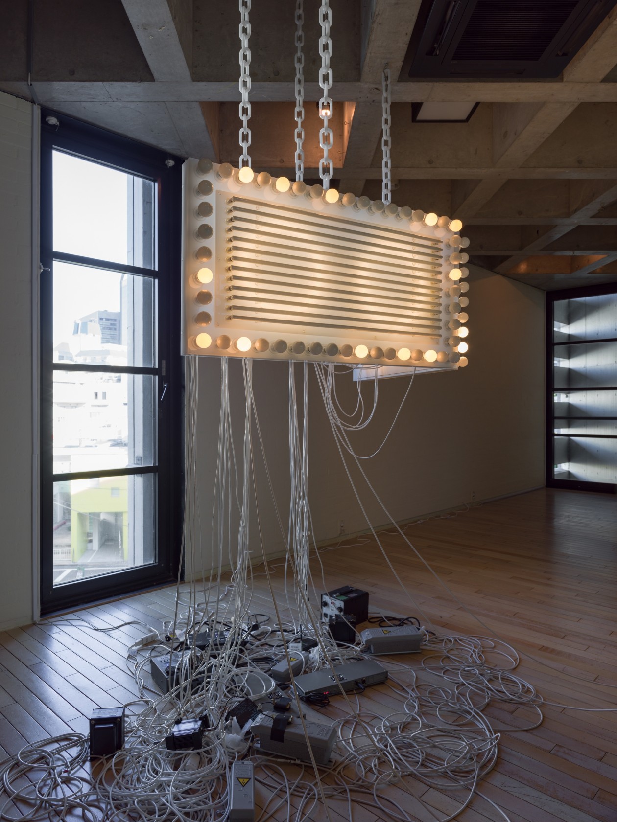 Marquee, 2016 Opaque Plexiglas, lightbulbs, neon tubes, DMX recorder, dimmers, transducers, light and sound program, opaque acrylic chains 60 x...