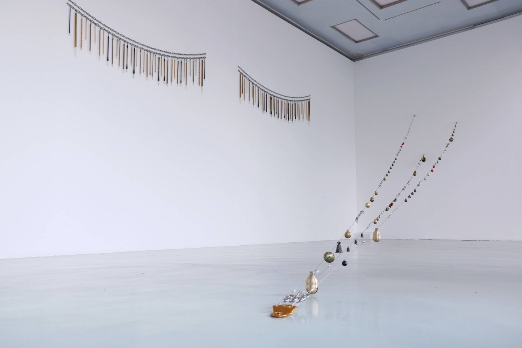 Buddha's Eyes, 2016 (left) Chinese brushes, steel chain 2 pieces: 15 x 158 cm each. Overall: 15 x 371 cm...