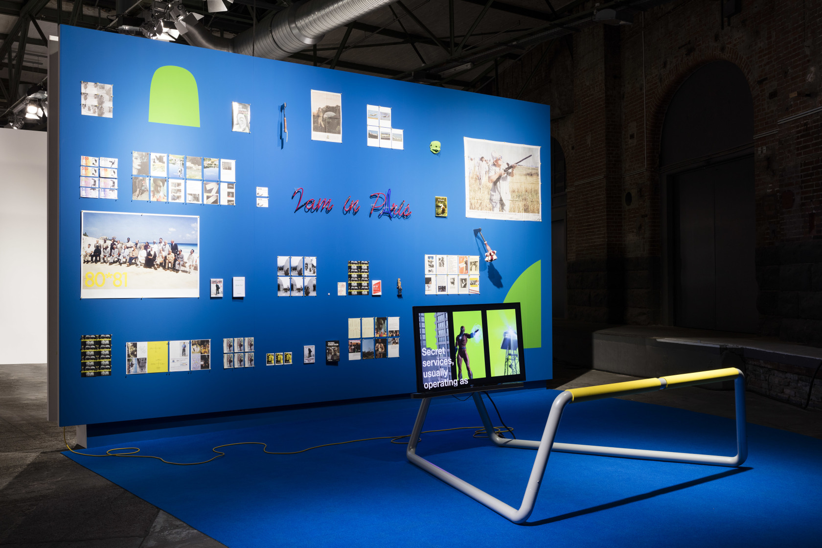 Christopher Roth, Presented By, 2016, 17 short films, viewing structure, neon, latex paint, hatchets, various posters and printed ephemera, installation...