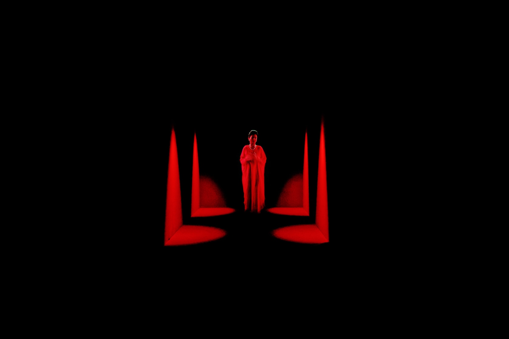 Dominique Gonzalez-Foerster, OPERA (QM.15), 2016, HD video, projector, screens, media player, amplifier, speakers, lights, curtains, minimum screening surface 1500 width...