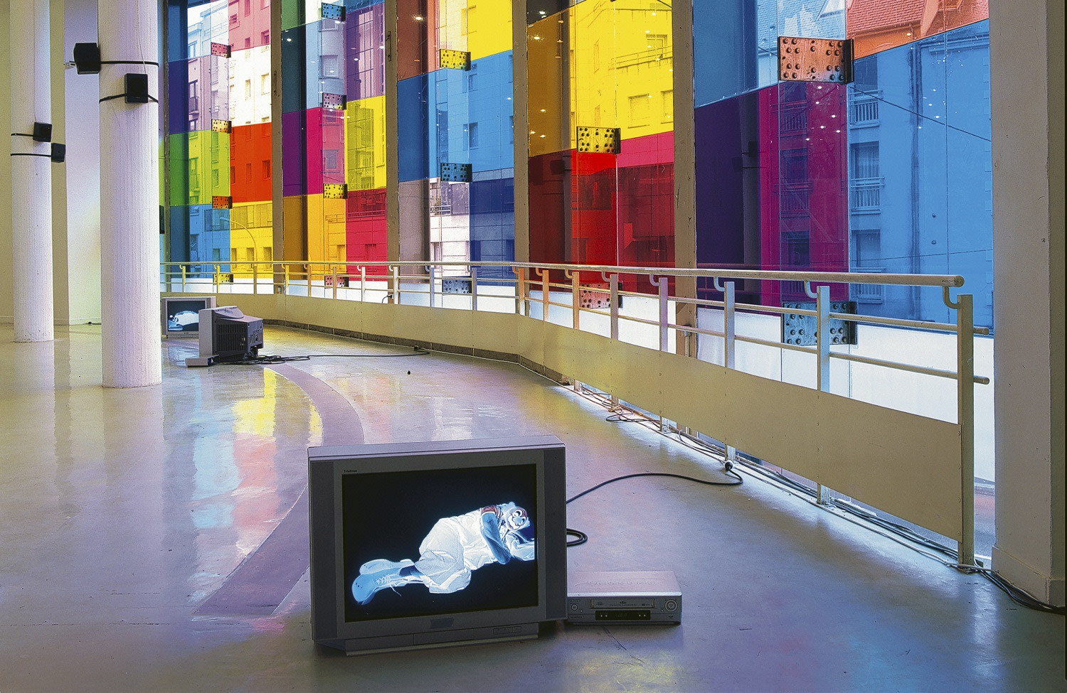 On the window: love invents us, 1999 (detail) Translucent film on window Dimensions variable Front: dog days are over, 1996...