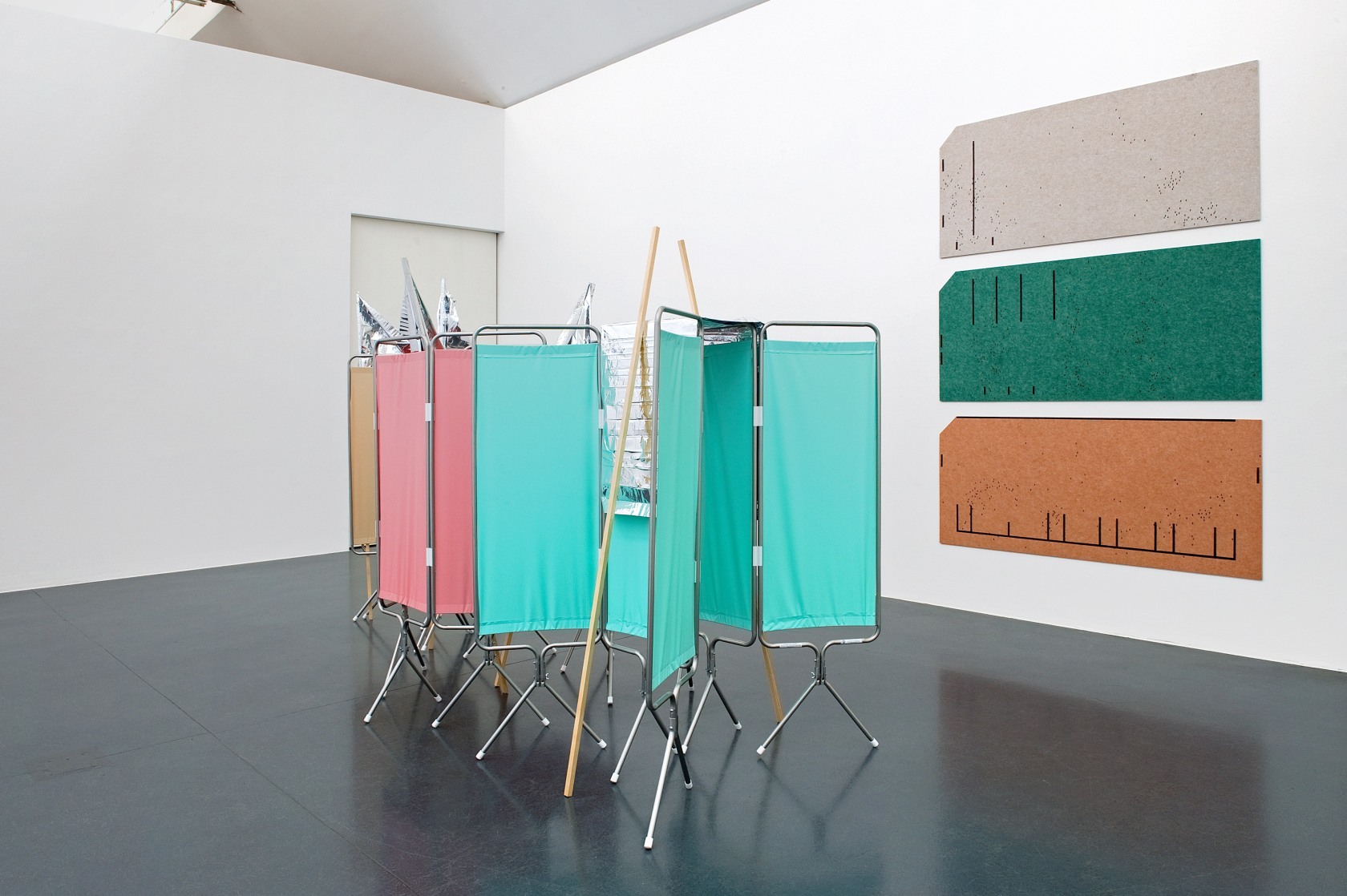 Privacy Standards, 2015 (left) Aluminum and polyester folding screens, aluminum blankets, wooden sticks, tape 210 x 358 x 128 cm...