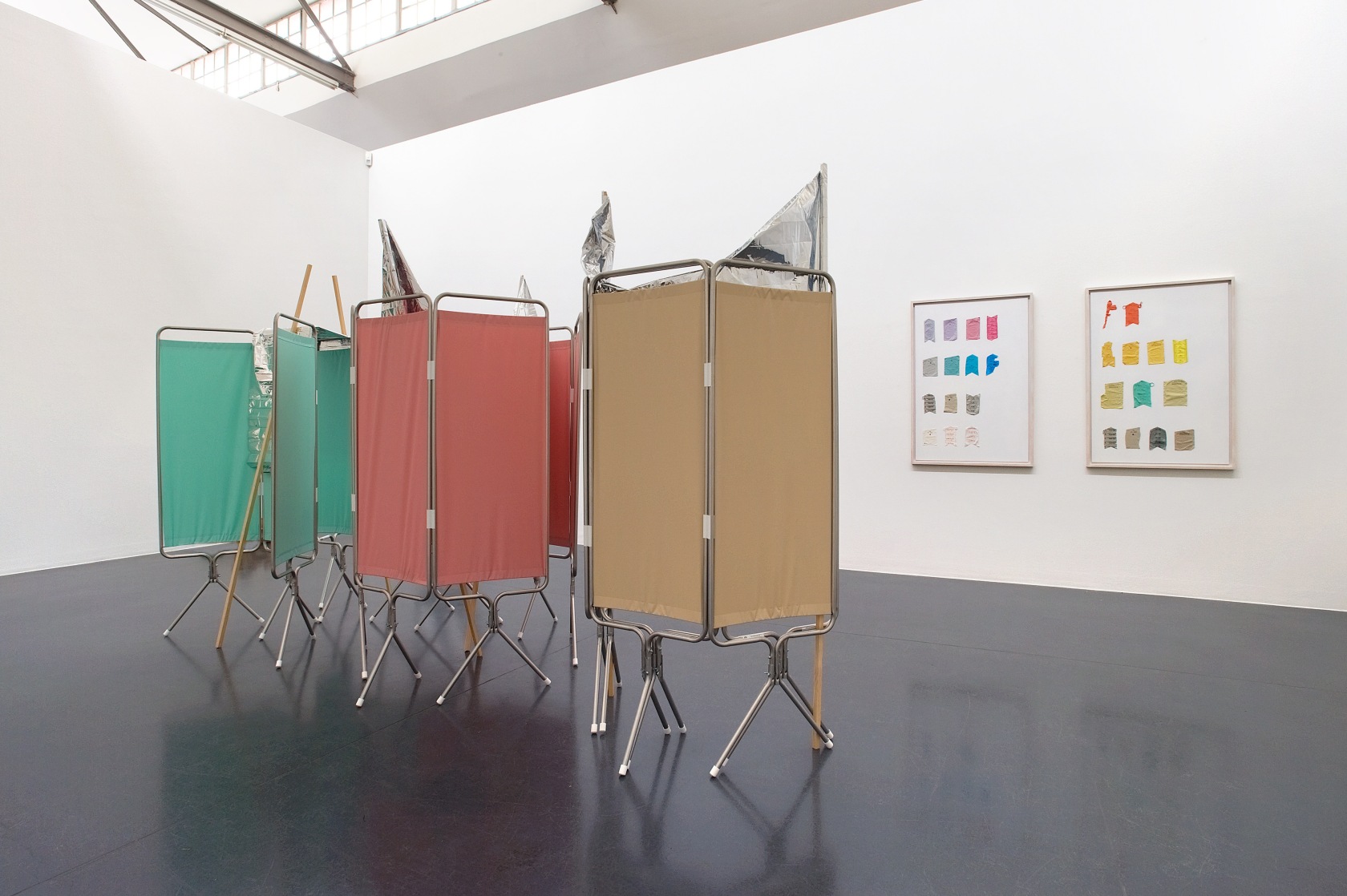 Privacy Standards, 2015 (left) Aluminum and polyester folding screens, aluminum blankets, wooden sticks, tape 210 x 358 x 128 cm...