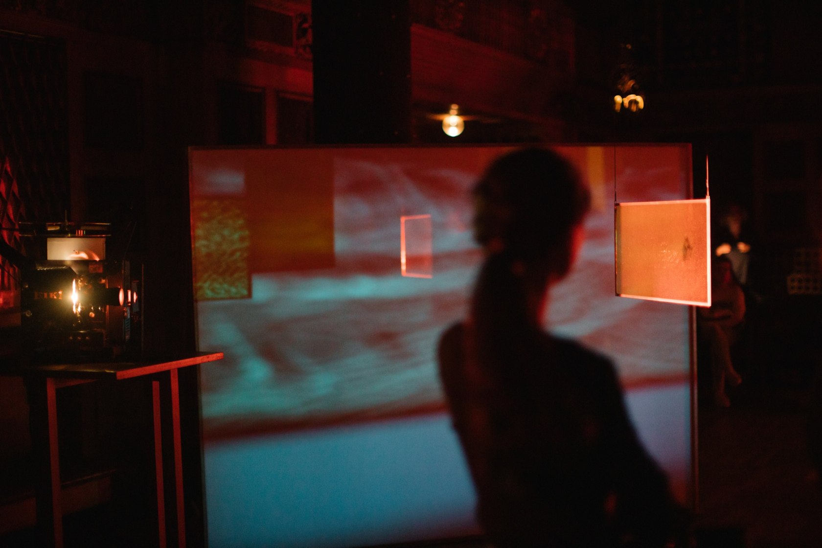 In a Perpetual Now of Instantaneous Visibility, 2019 Performance, 16mm projectors, glass filters, 35mm projector, screens, drums, cello Performance view...