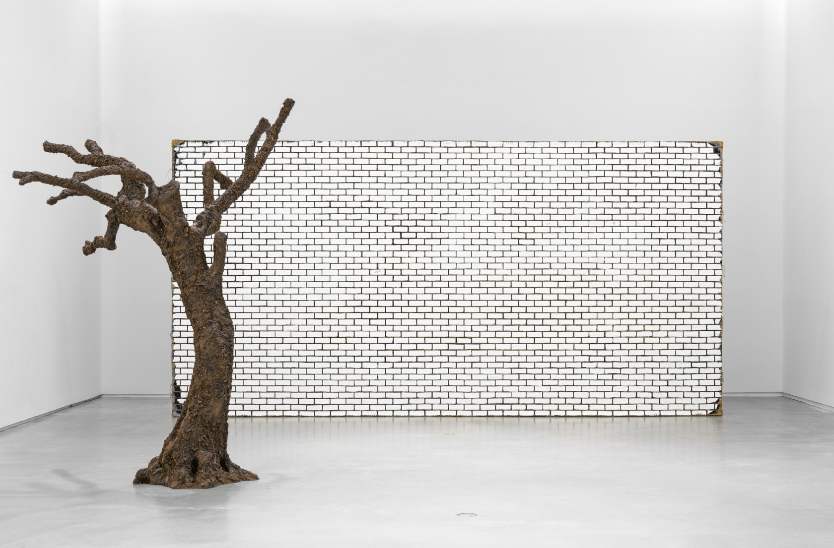 Exhibition view: a wall. a door. a tree. a lightbulb. winter, Sørlandets Kunstmuseum, 2021 Photo © SKMU