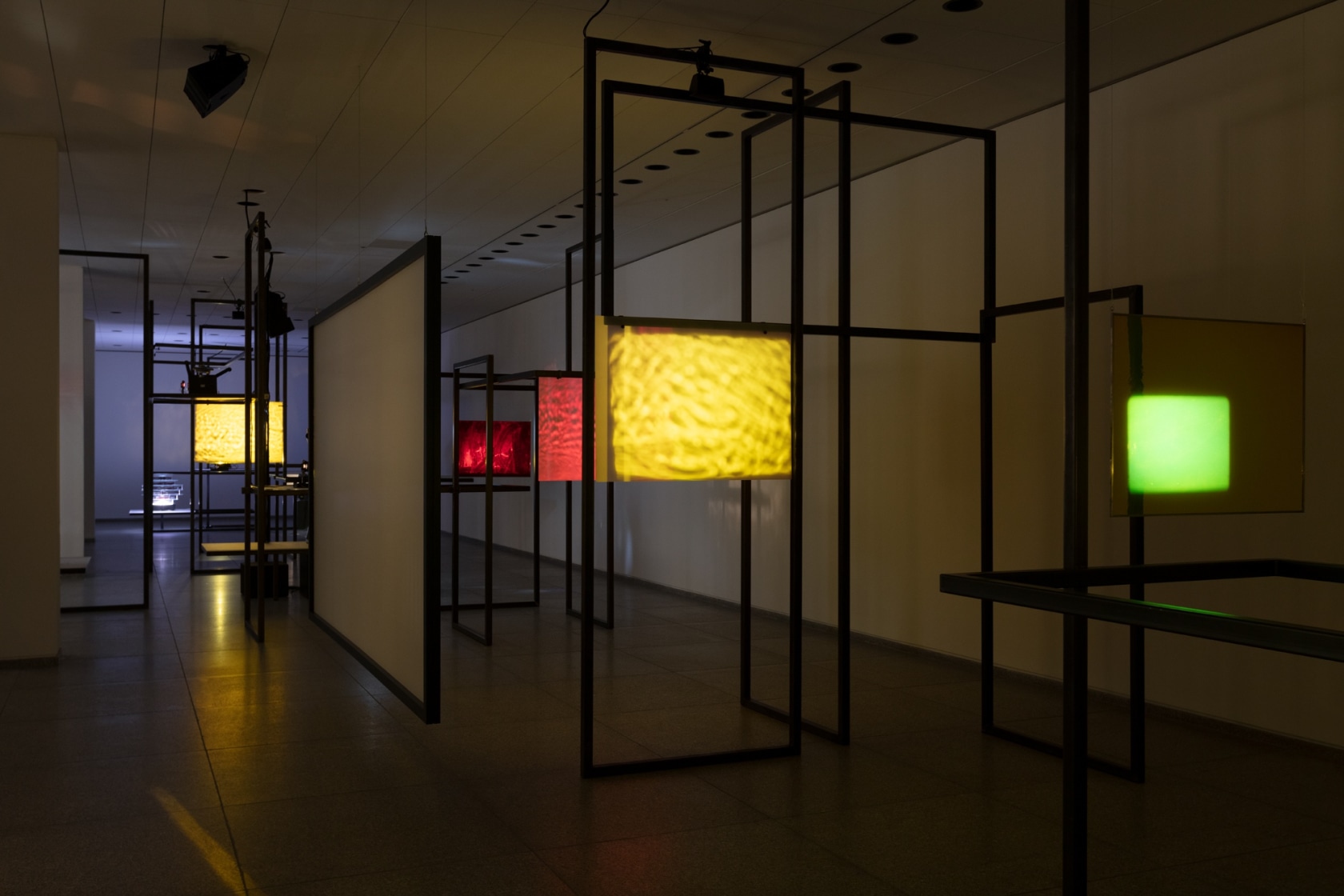 Rosa Barba Hear, There, Where the Echoes Are, 2016/2021 16 mm projectors, 35 mm projector, glass filters, screen, sound, performative...