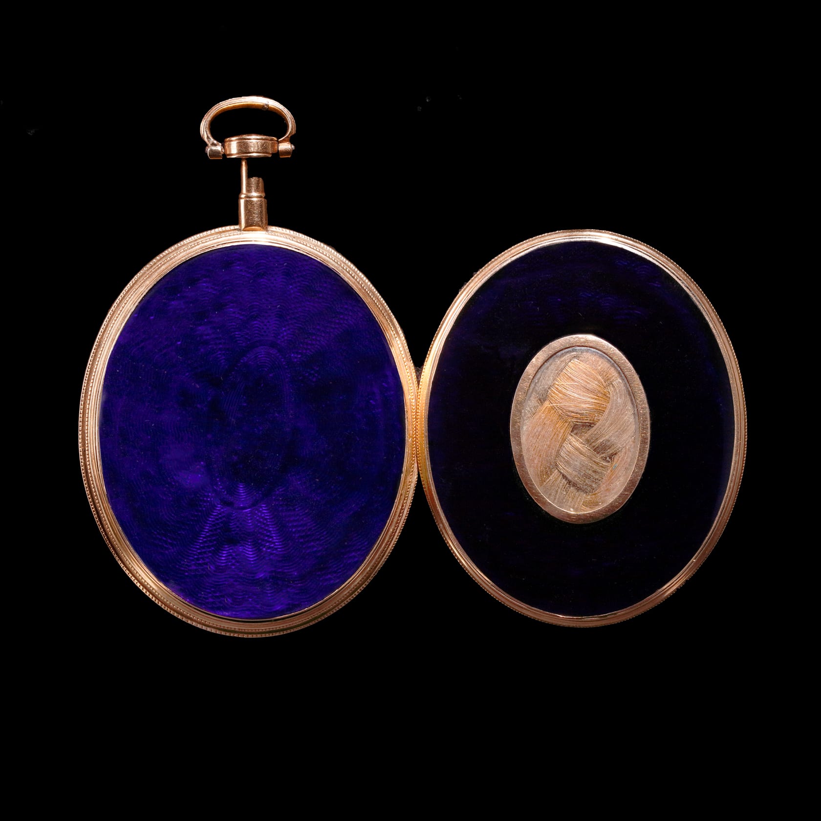 Watercolour on ivory set in (original) gold fausse-montre locket case, the exterior with hair panel and blue glass Ovals, 1 ½ in (40 mm) high
