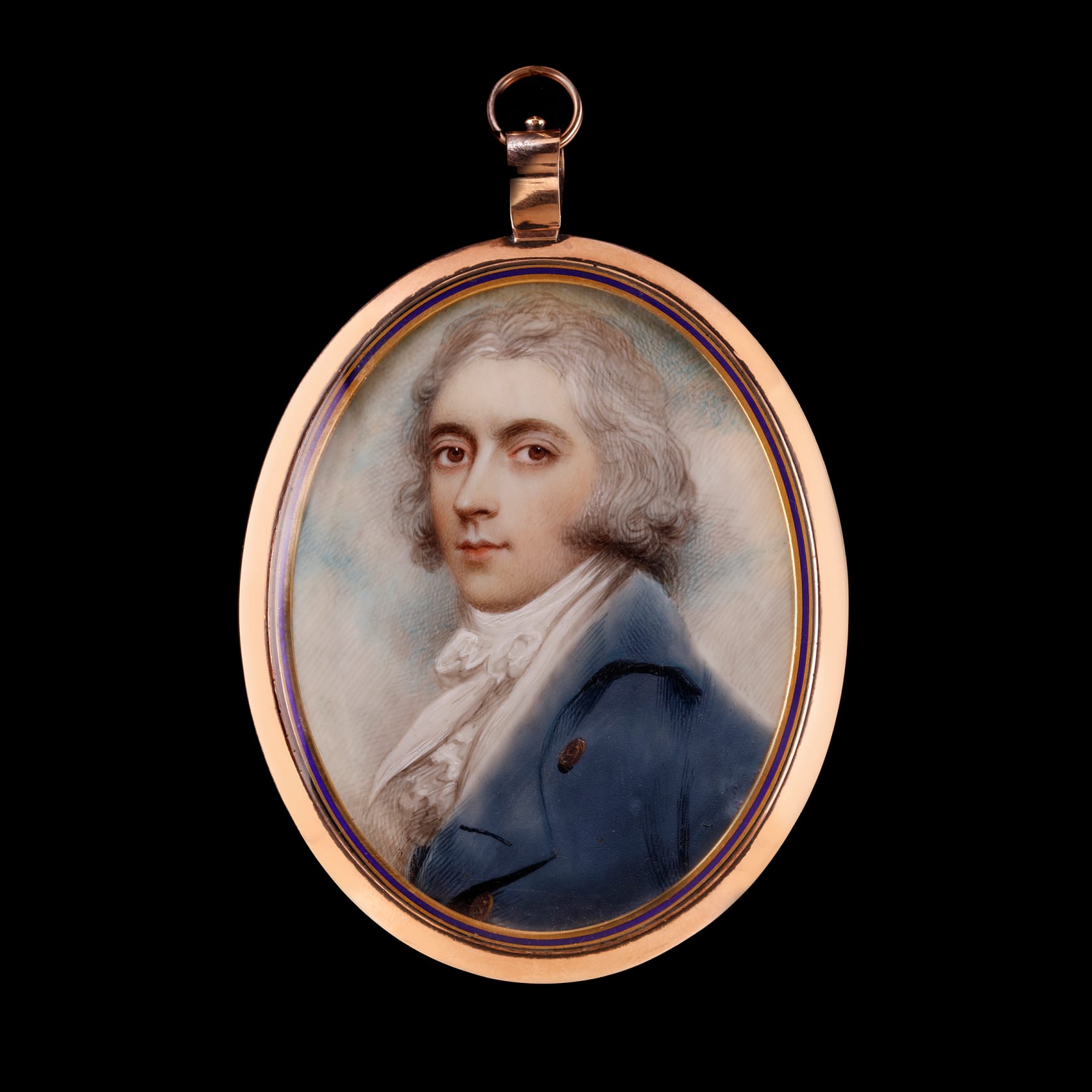 Set in gold frame with blue enamel border, the reverse with plaited hair Oval, 2 3/4 in (70 mm) high