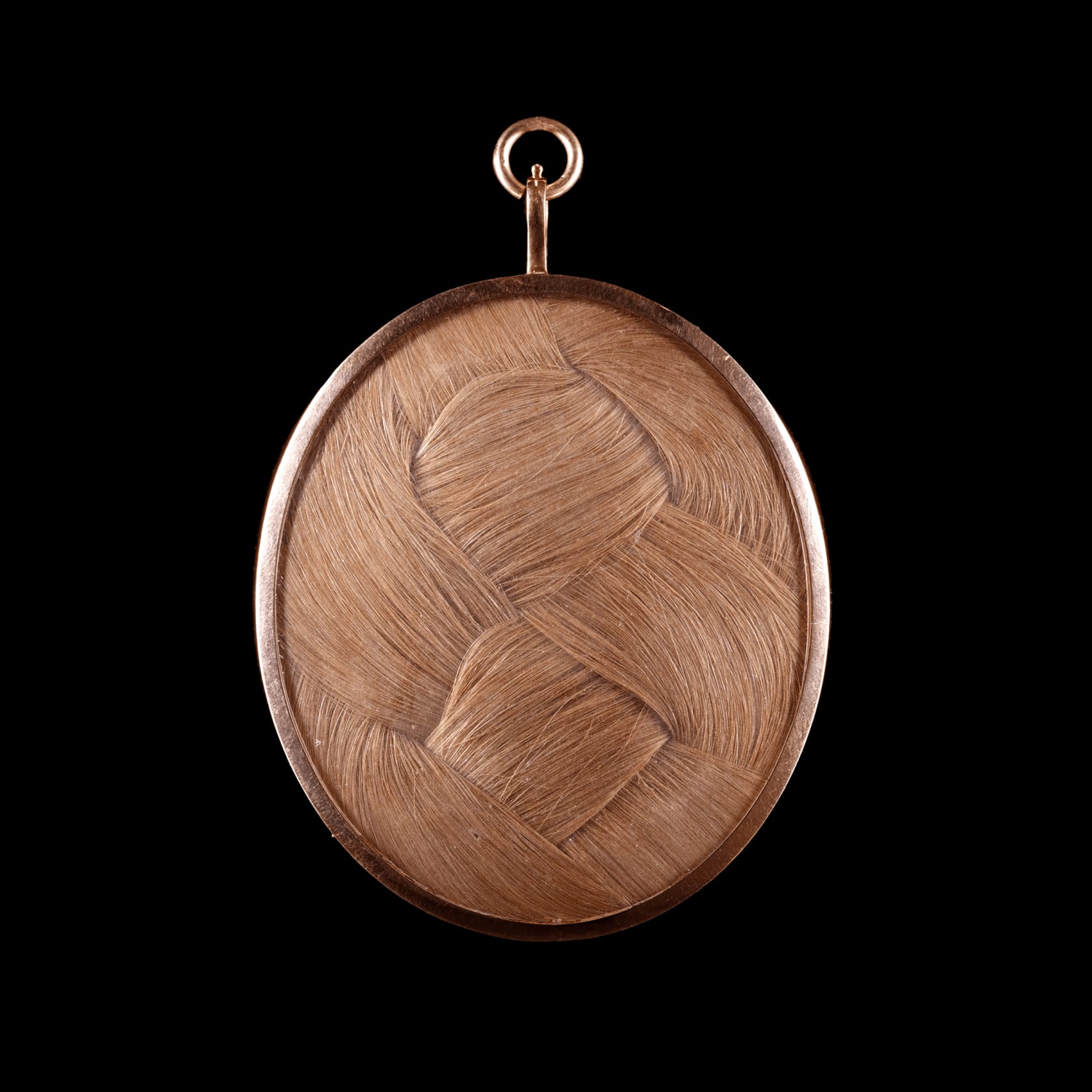 Signed 'IB. / 1787.' lower left Watercolour on ivory in gold hexagonal mount and set in gold frame with blue glass border, the reverse with plaited hair Oval, 1 1/2 in (38 mm) high