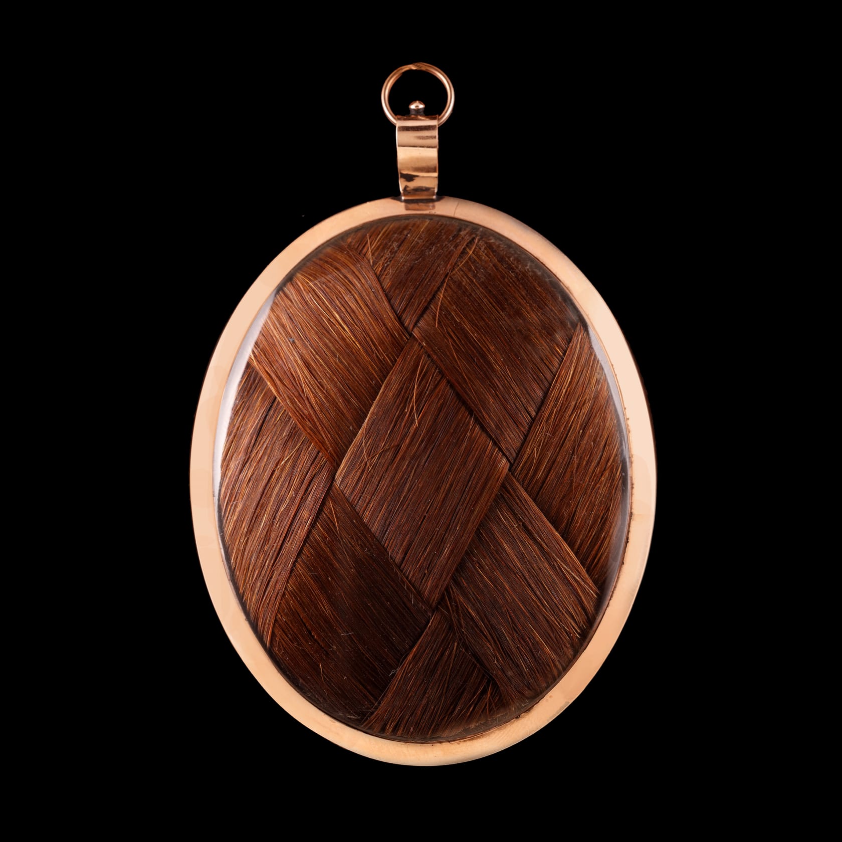 Set in gold frame with blue enamel border, the reverse with plaited hair Oval, 2 3/4 in (70 mm) high