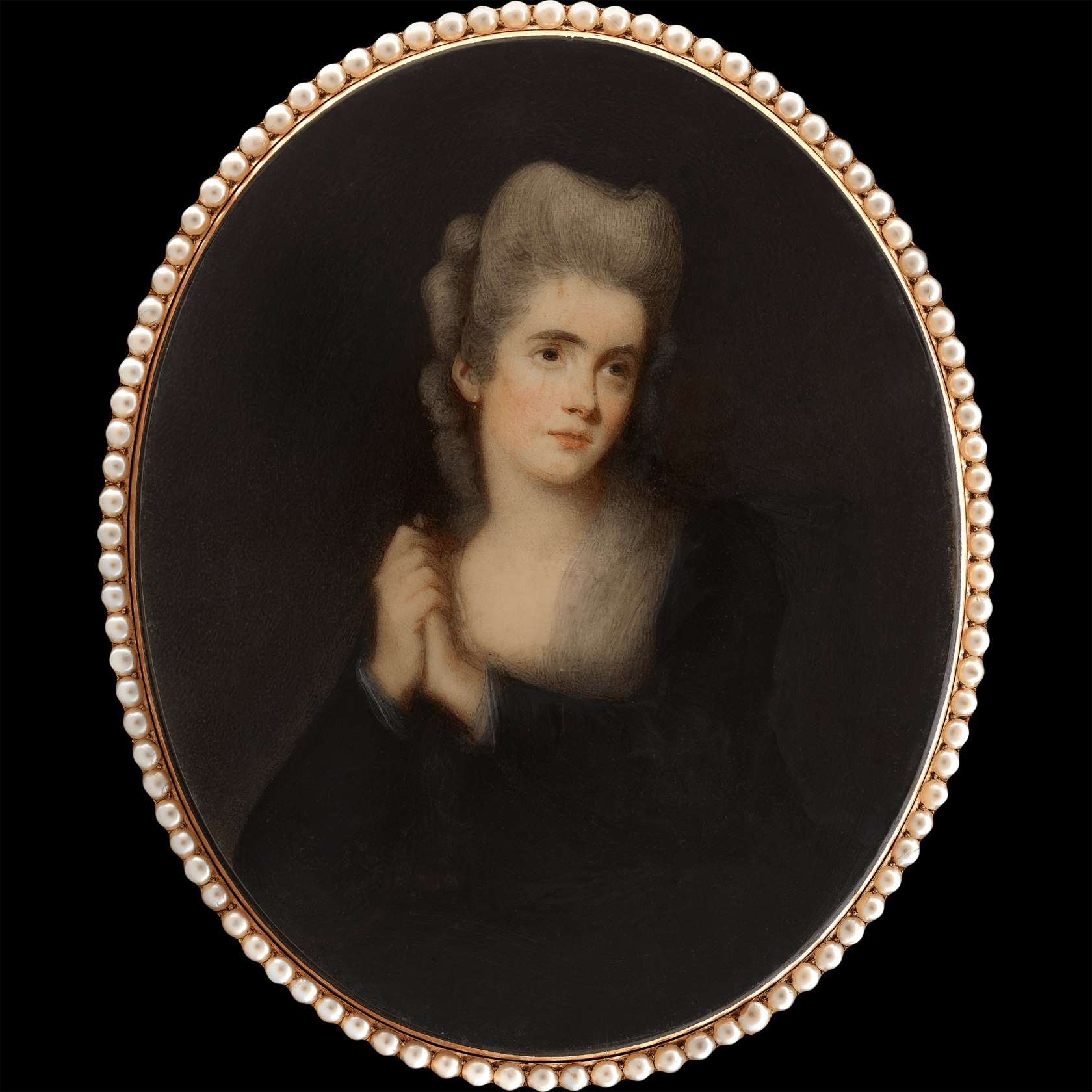 Signed on reverse with gold monogram ‘MAK’ Watercolour on ivory set in gold frame with bright cut border, on plaited hair within further bright cut work Oval, 4 in (102 mm) high