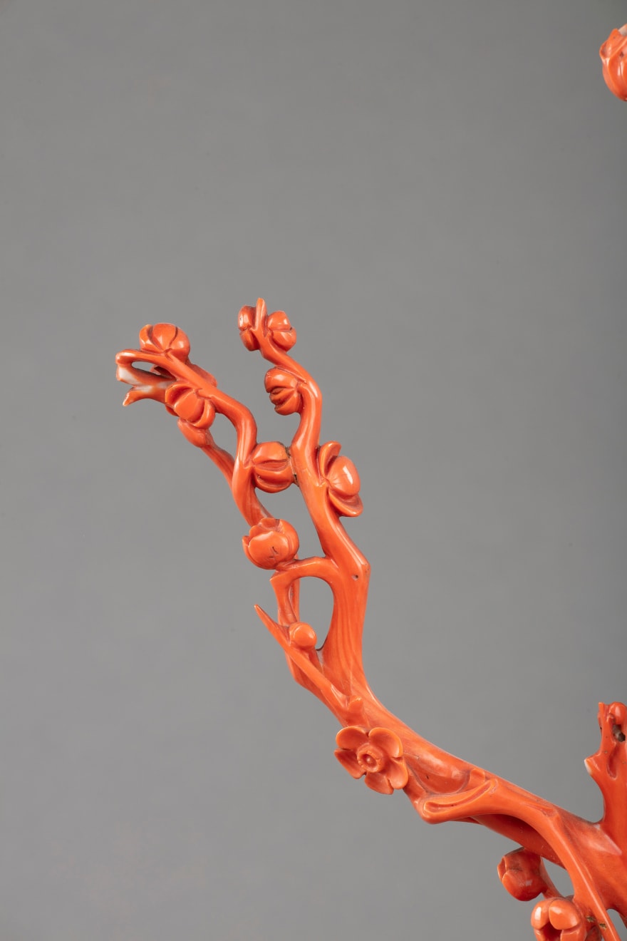 China, Coral Guanyin figure, resting on wooden base, XIX century