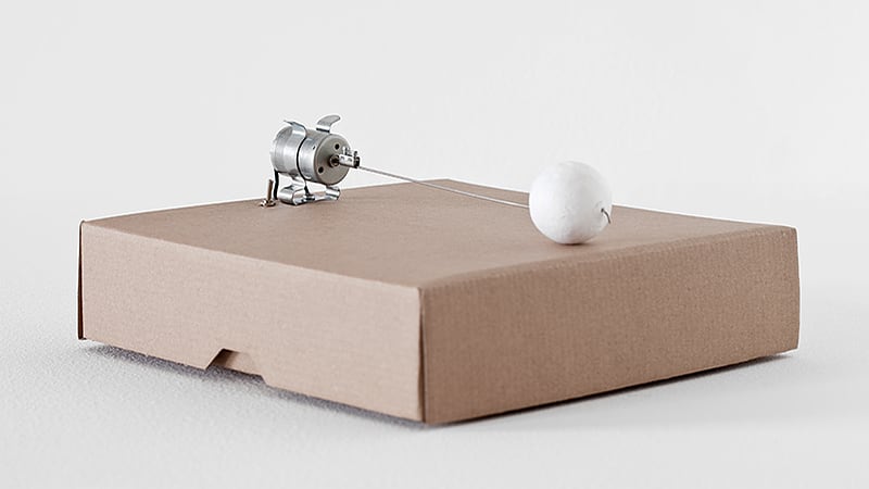 Zimoun, 1 prepared dc-motor, cotton ball, cardboard box 23x23x6cm, 2014