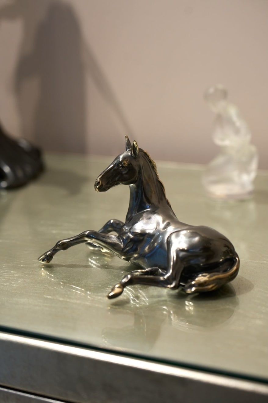 100% hand crafted bronze sculpture of a lying horse. Patinated bronze, 20 cm.