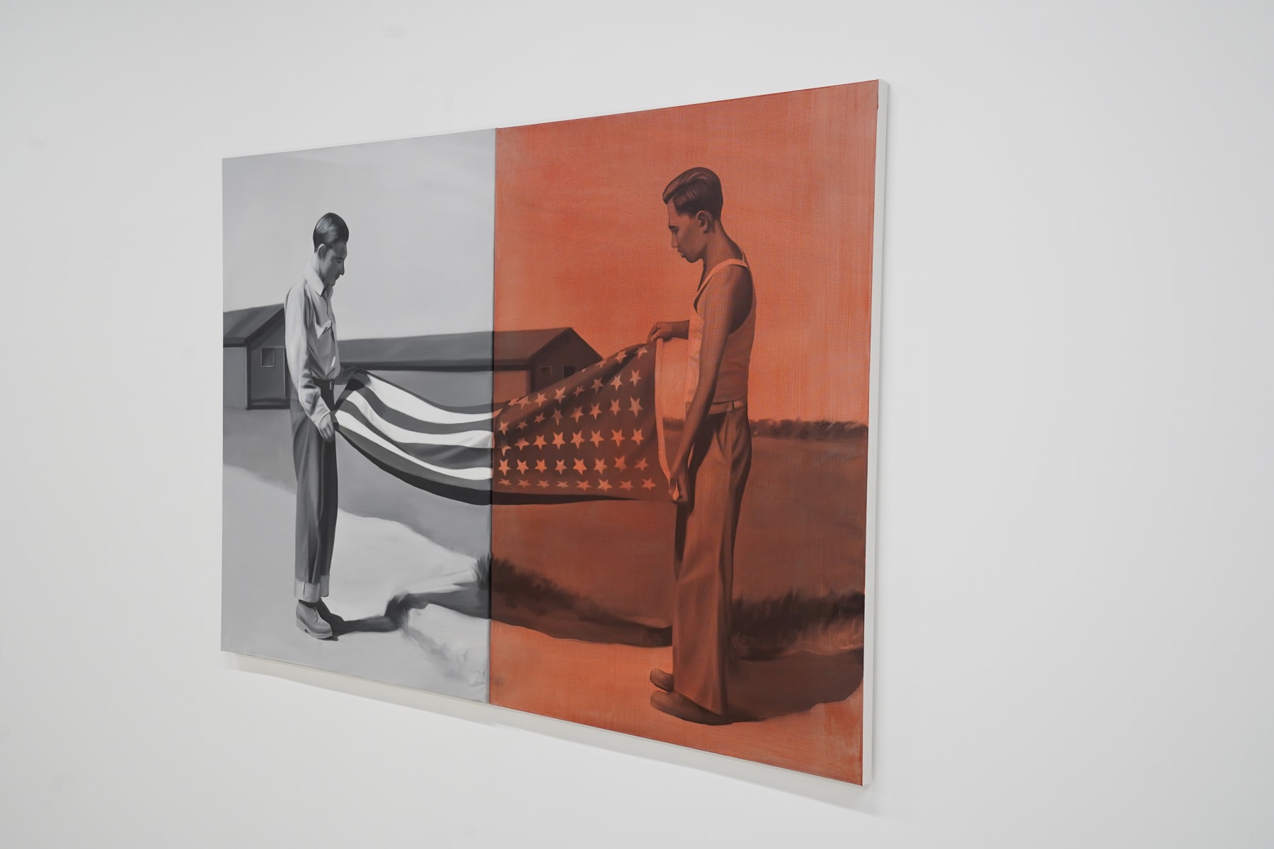 black and white painting of two men folding a flag. Half the painting is washed in red