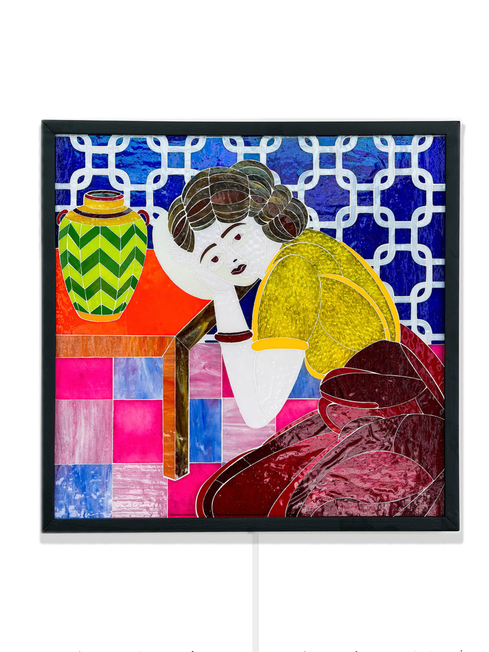 stained glass mosaic of a girl leaning on a table