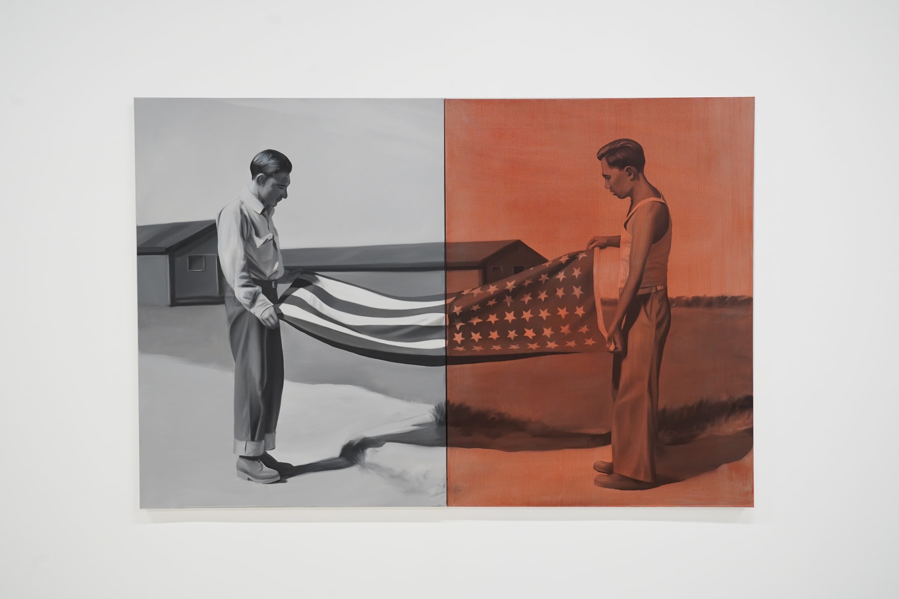 black and white painting of two men folding a flag. Half the painting is washed in red