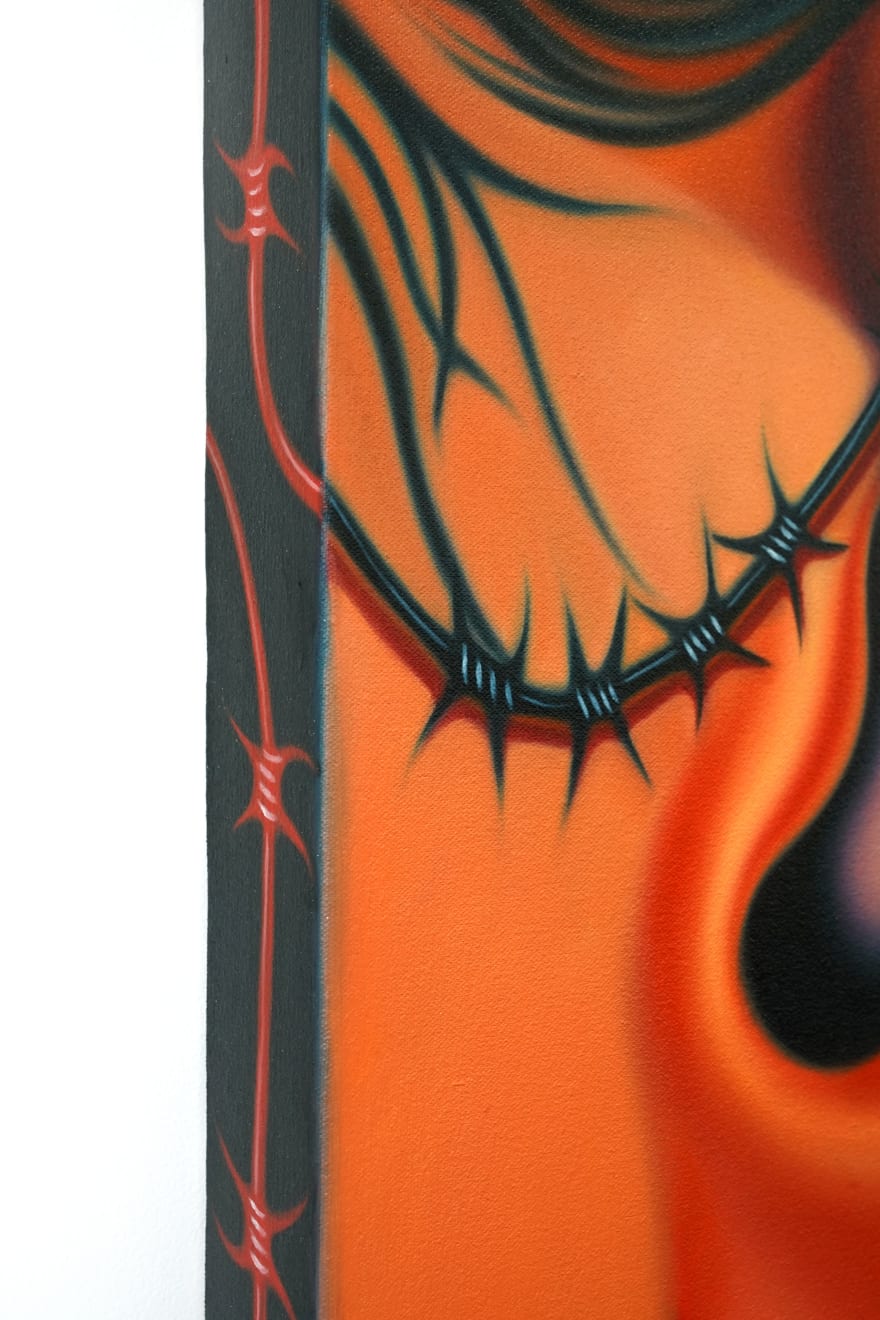 painting of an ear with barbed wire running along it