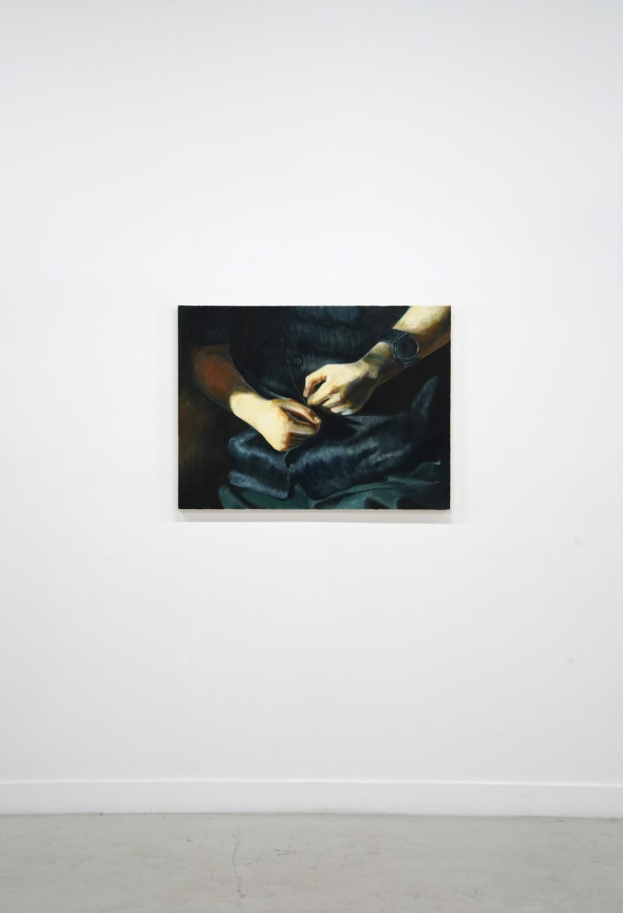 painting of hands sitting in a lap making fists