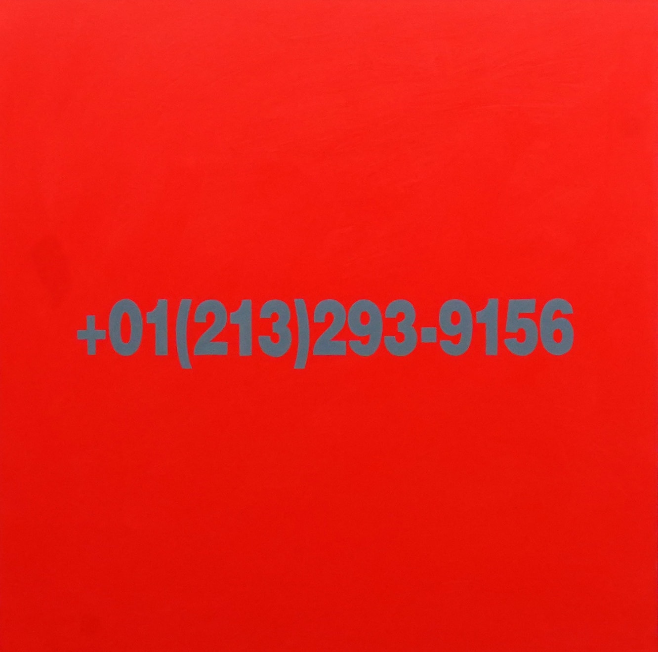 red painting with a phone number in the middle