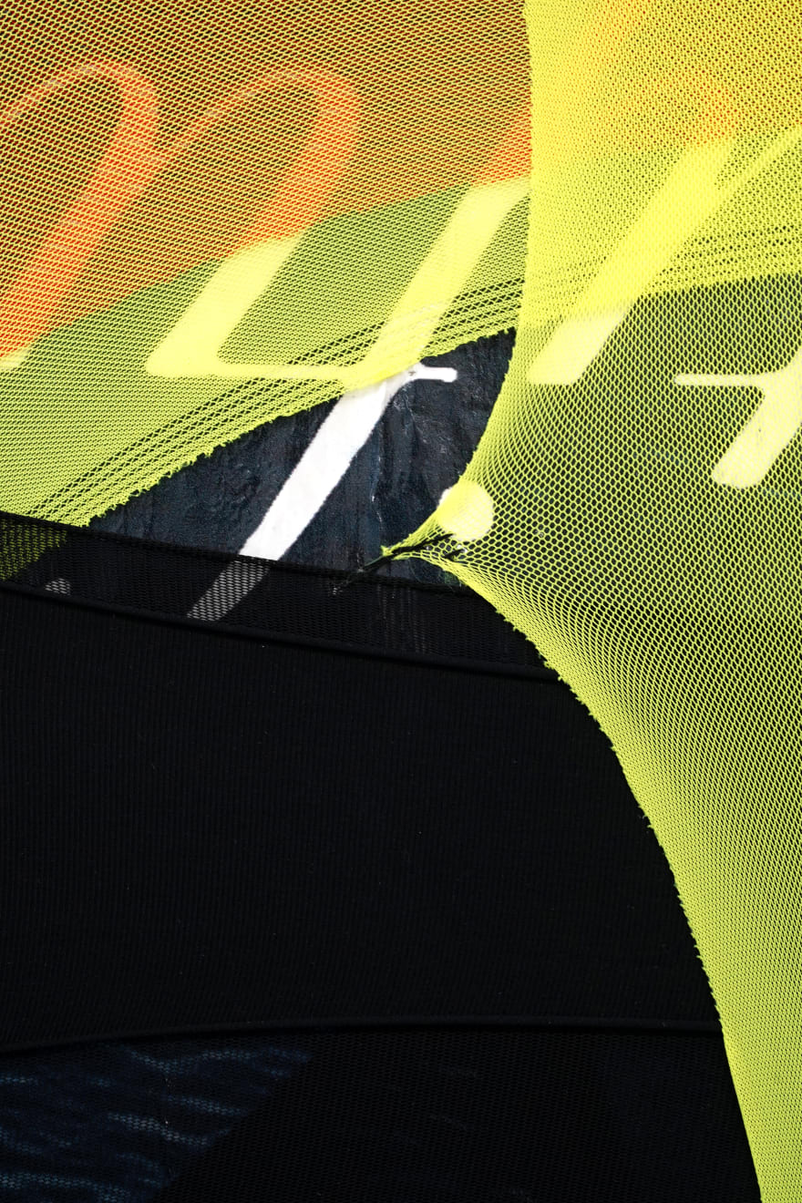 abstract fabric artwork including a text that says 