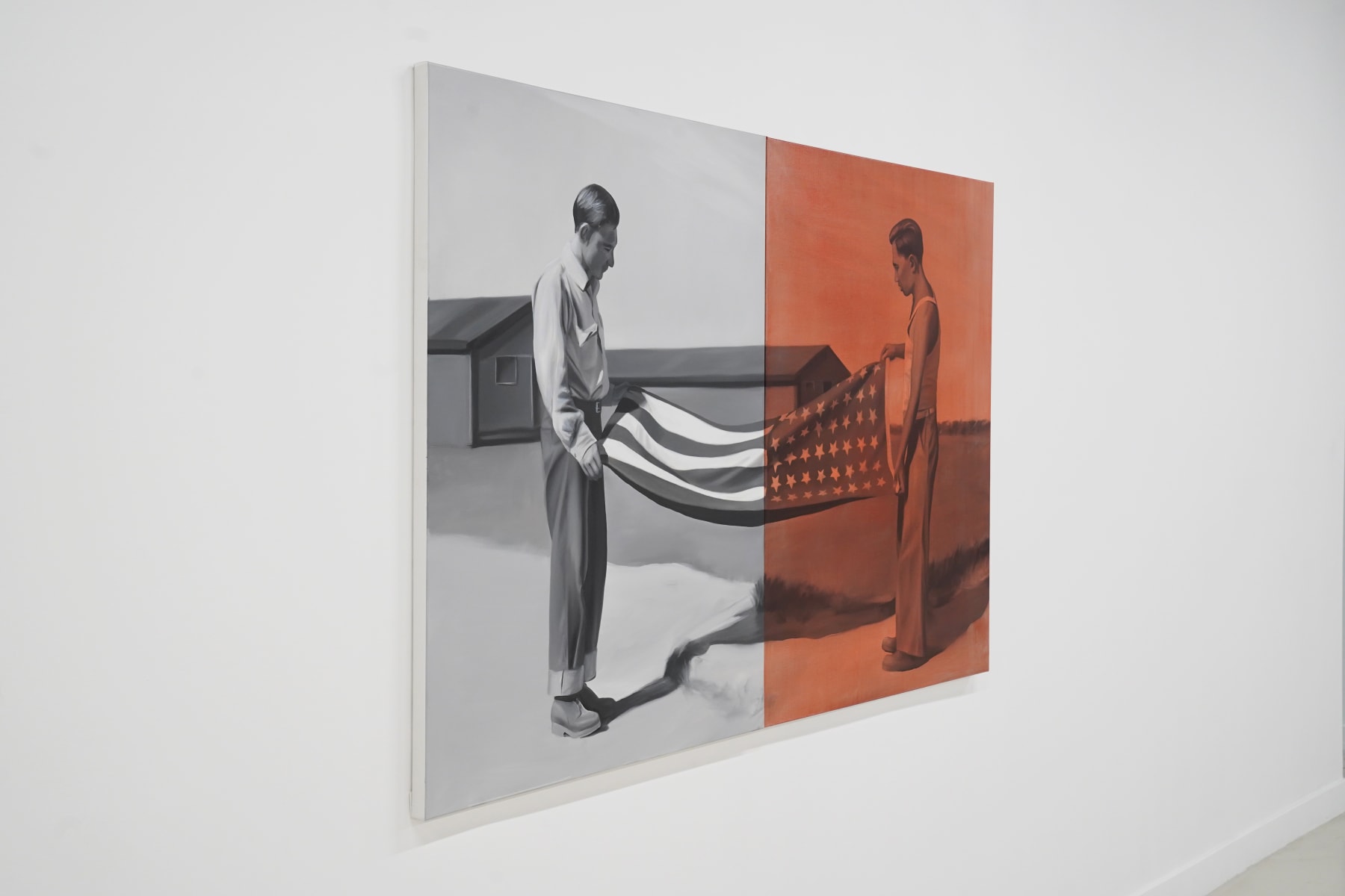 black and white painting of two men folding a flag. Half the painting is washed in red